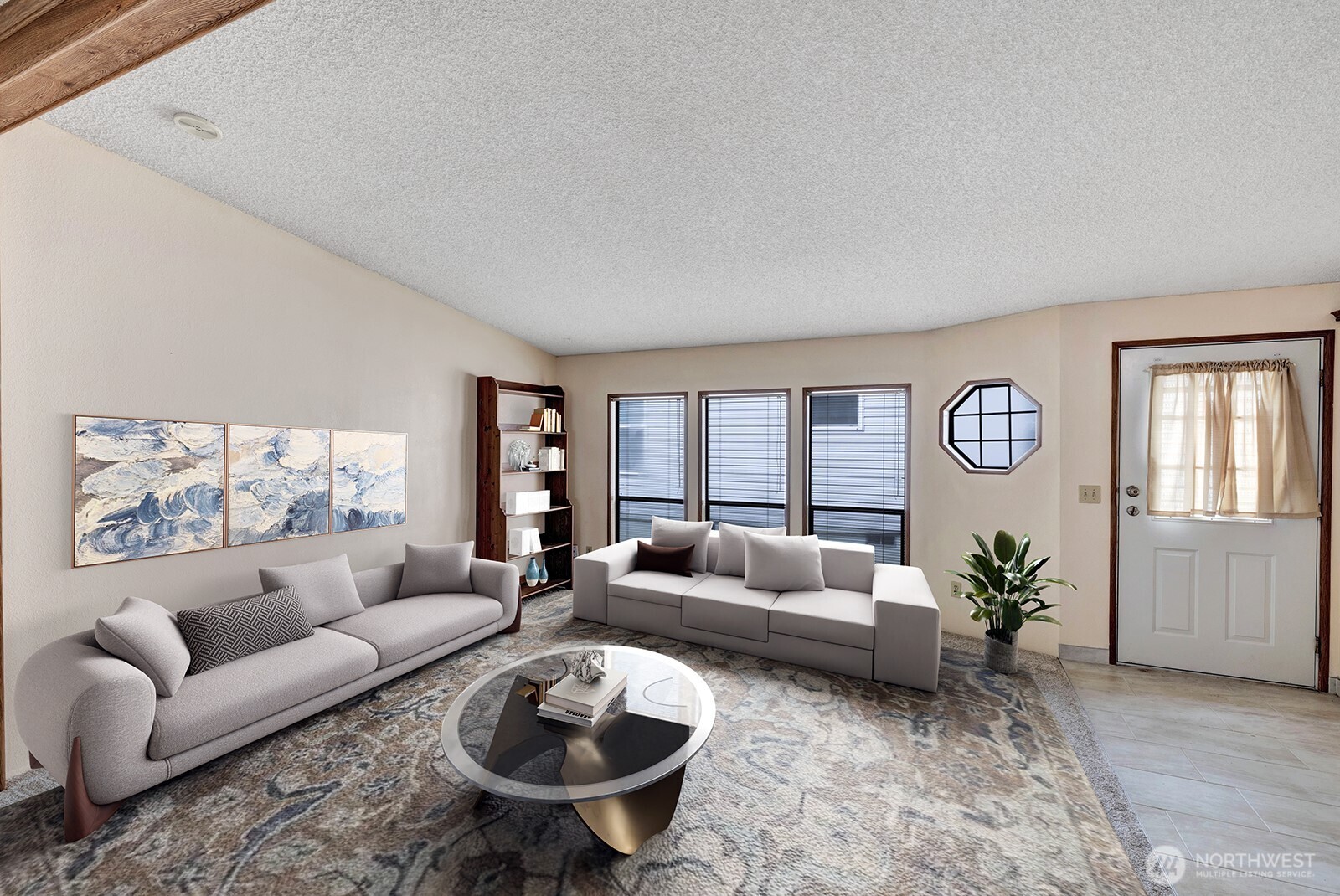 Tile at the formal entry into the home. Vaulted ceilings, textured walls, neutral color scheme and floor to ceiling windows are just some of the interior features of this home.