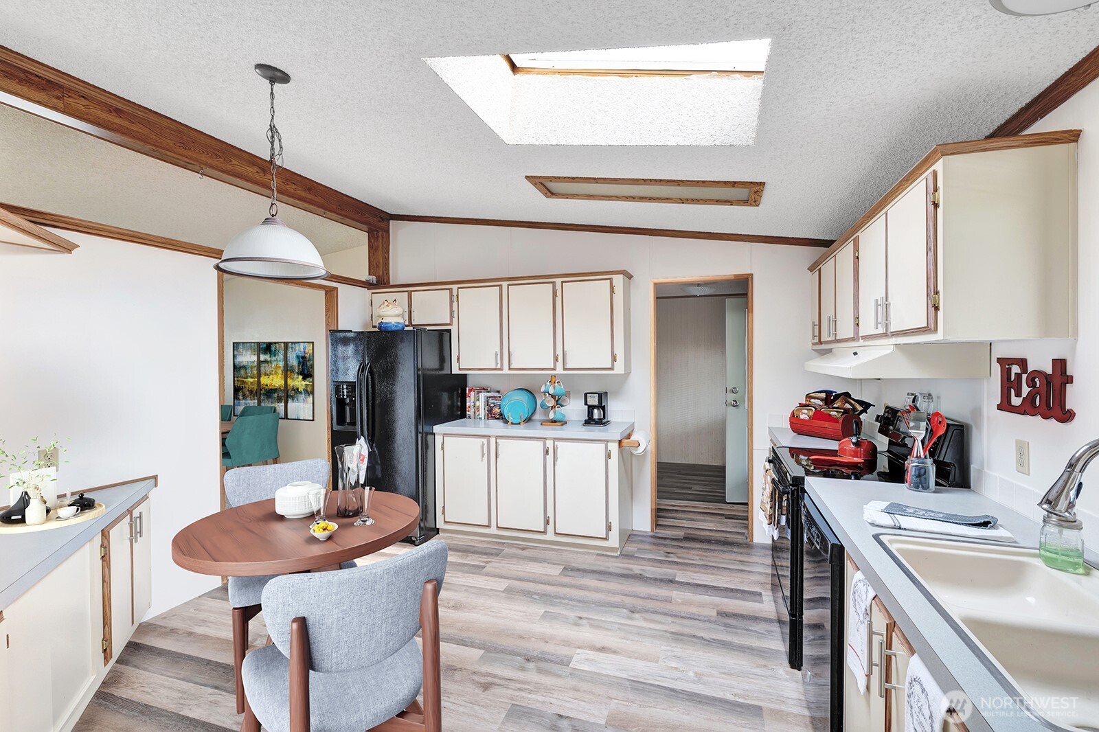 Open and spacious kitchen area. Updated flooring and counter tops. Ample storage and prep space. Skylights bring in notable natural lighting.
