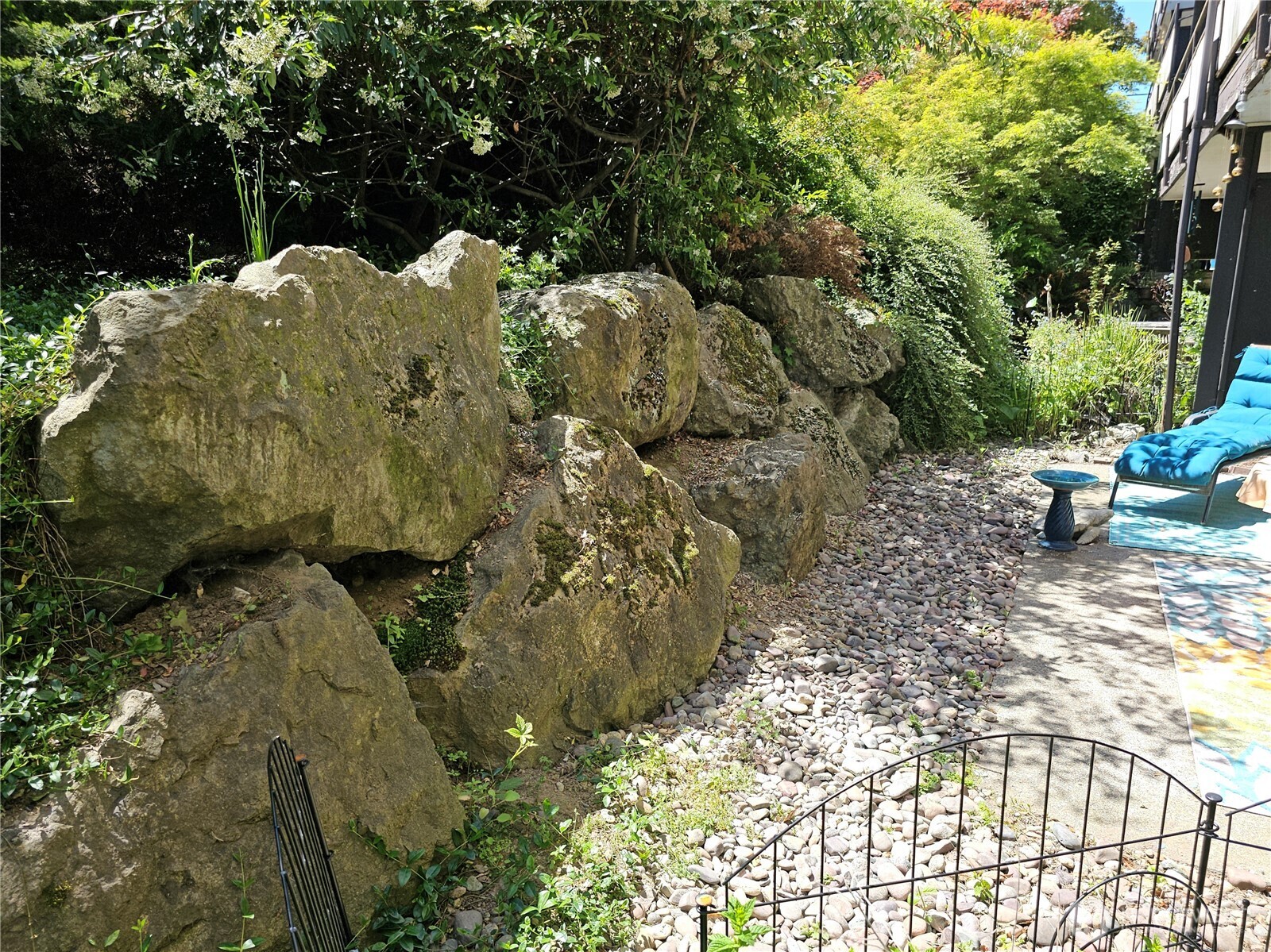 The large rock wall creates a cove of privacy.
