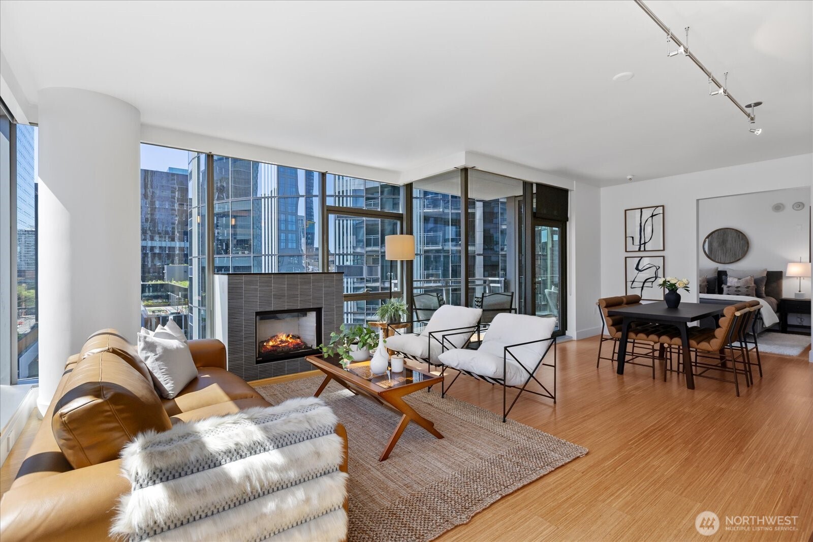 Open great room with gas fireplace. Southern and westerly windows create a space flooded with natural light.