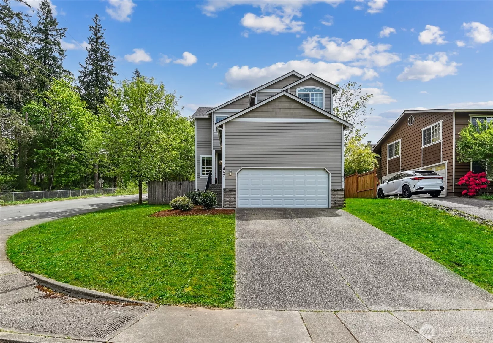 This beautiful two story home is directly across the street from Lake Youngs Reservoir and hiking trail. New roof, garage door and door opener, freshly painted inside, new carpet throughout, new microwave, gas range and dishwasher. Move in ready!