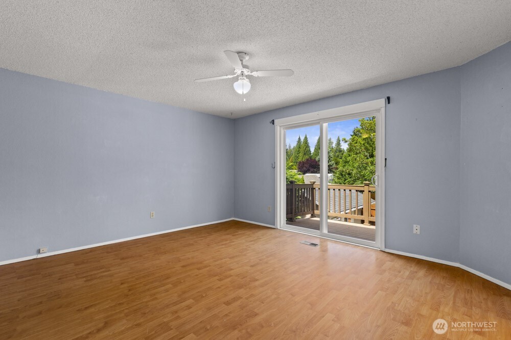 The spacious primary suite offers a peaceful retreat with room to stretch out and relax.
