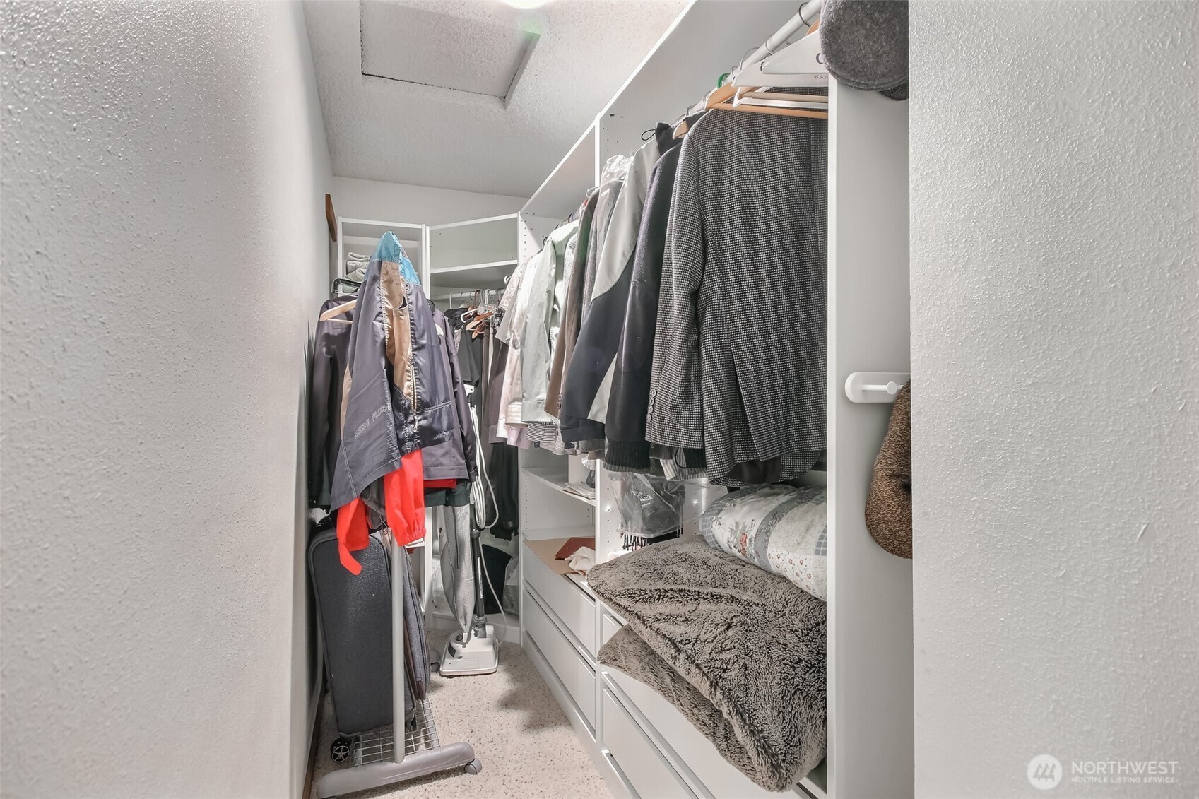 Walk-in closet has organizer