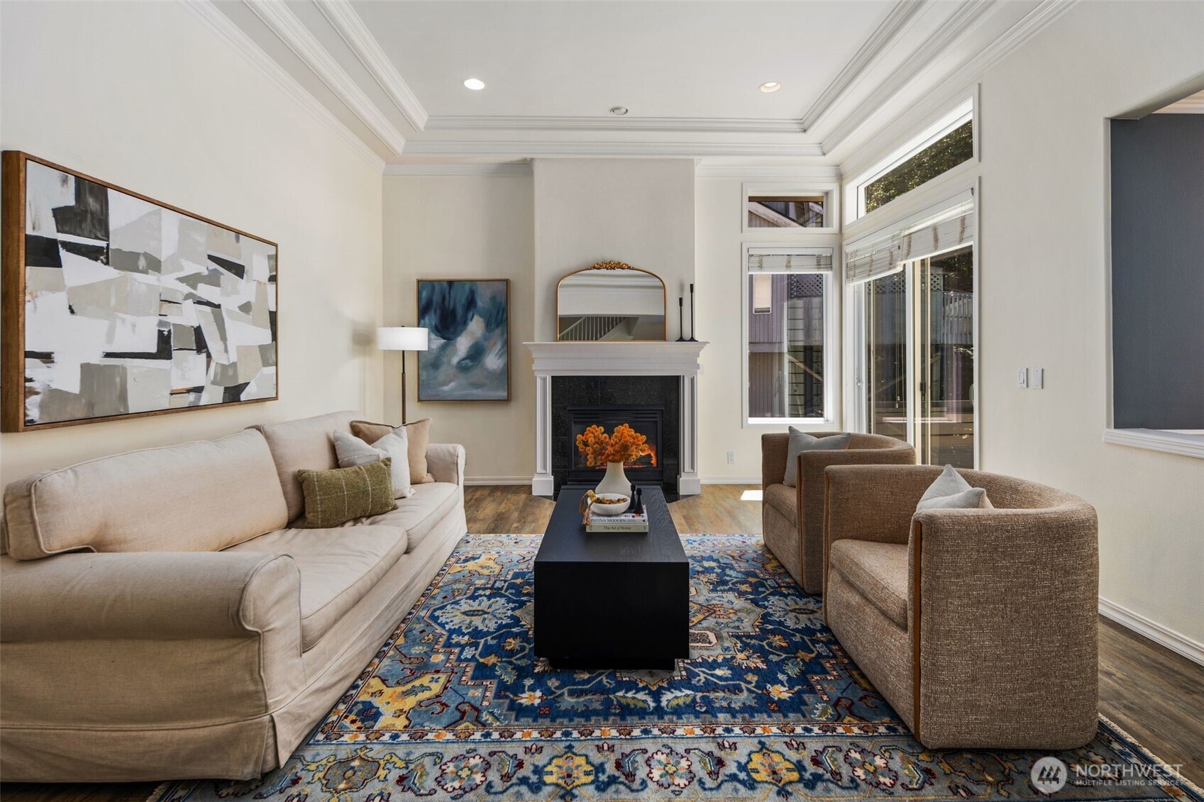 Living room with gas fireplace and access to deck.