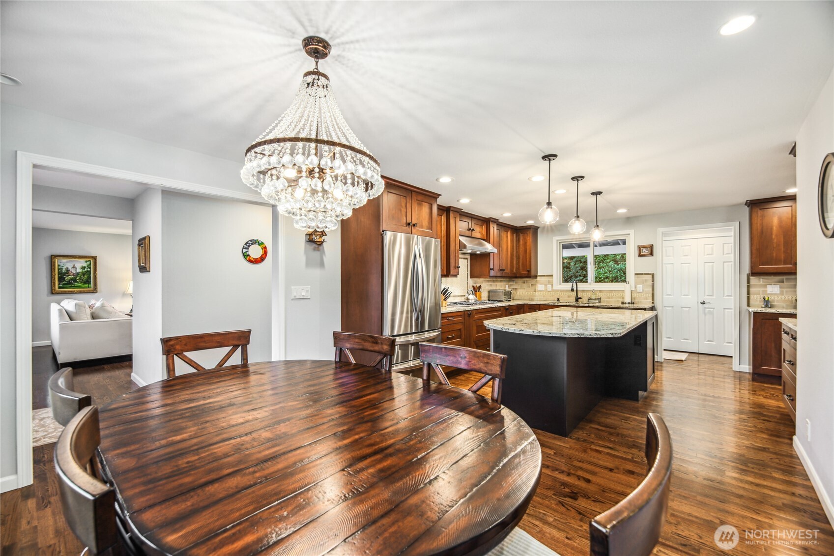 A beautiful light-filled dining and kitchen is a focal point of this mid-century Bellevue home.