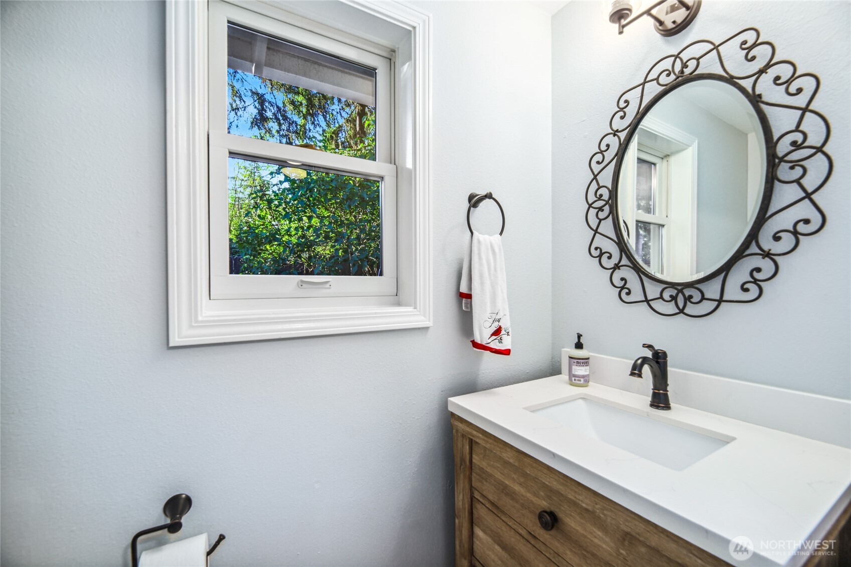 Charming powder bath off laundry suite.