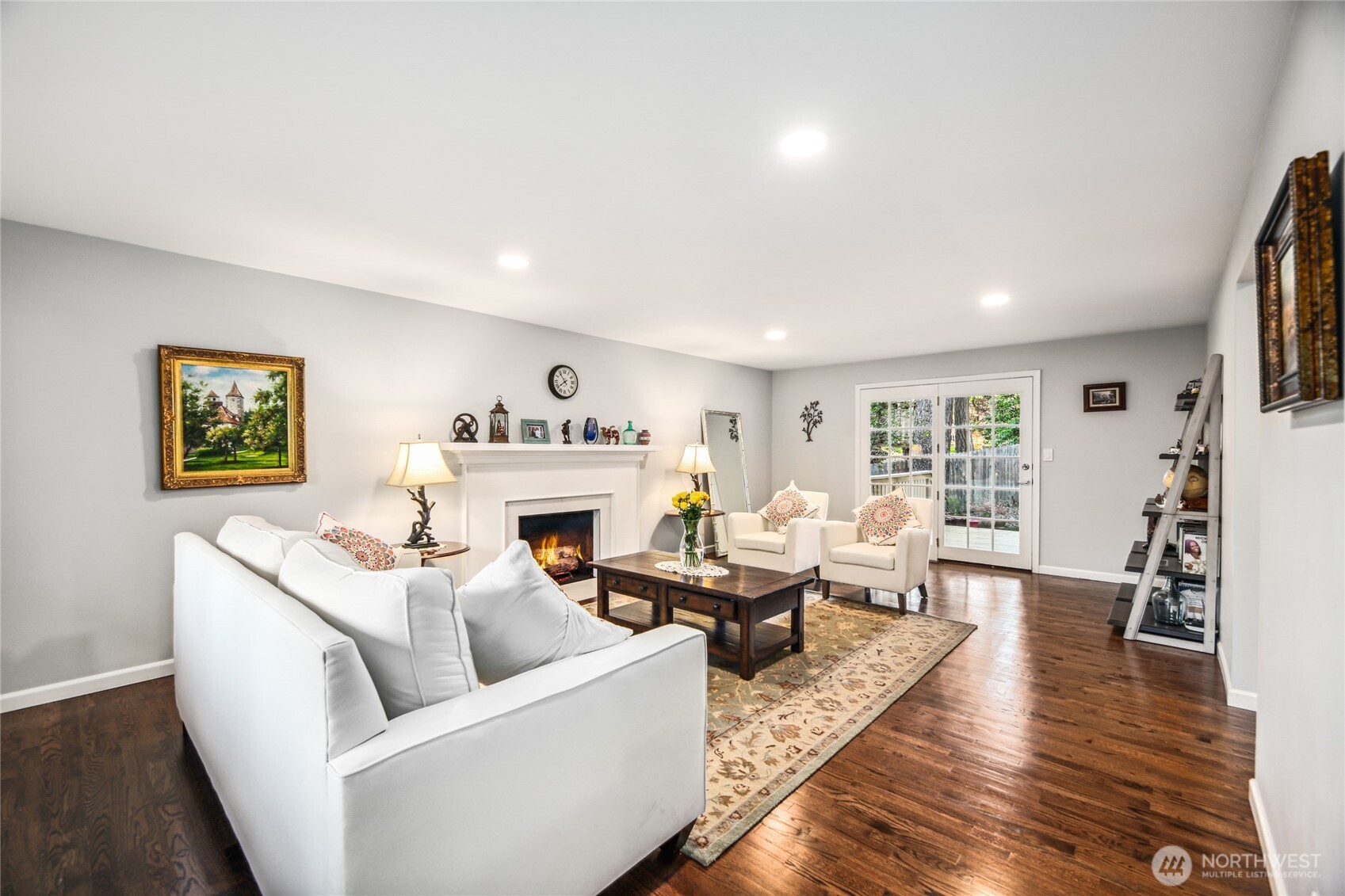 Bright and perfectly updated with all new paint, stunning hardwoods and a modern fireplace tile surround.