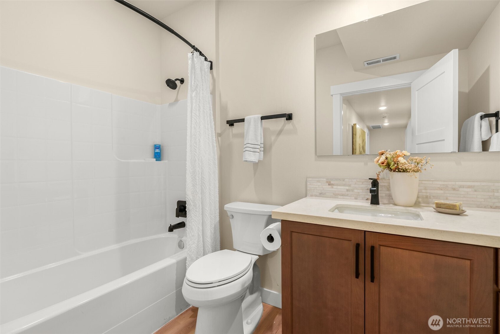 Lower full bathroom in hallway.
