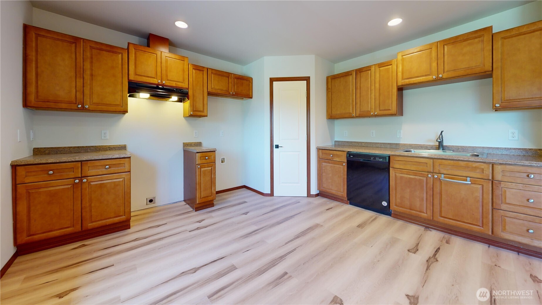 Private entry to ADU, laundry closet, coat closet, and pantry connecting to main home