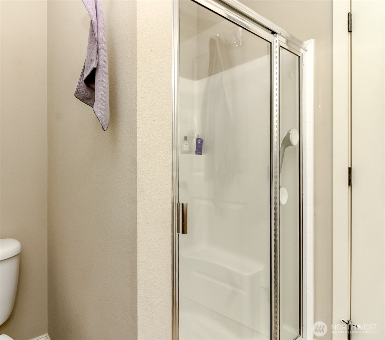 Step-in shower in the primary bathroom.