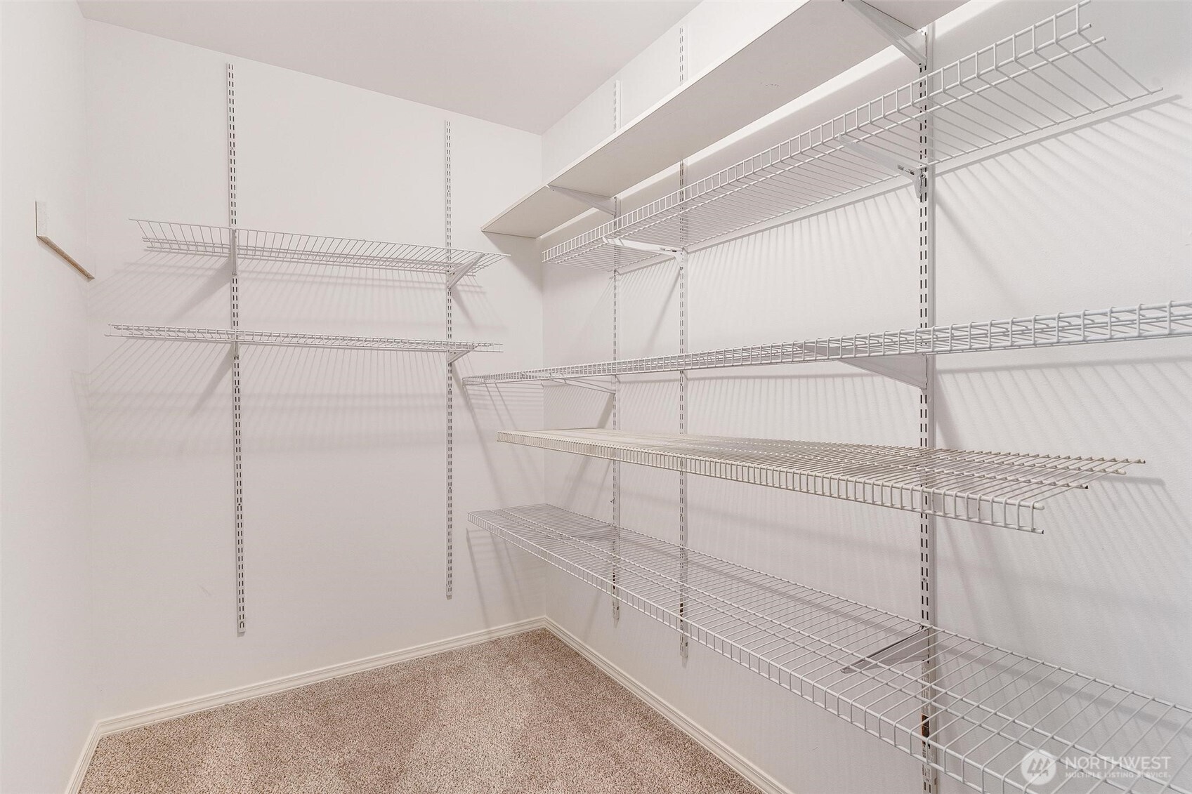 Primary walk-in closet.