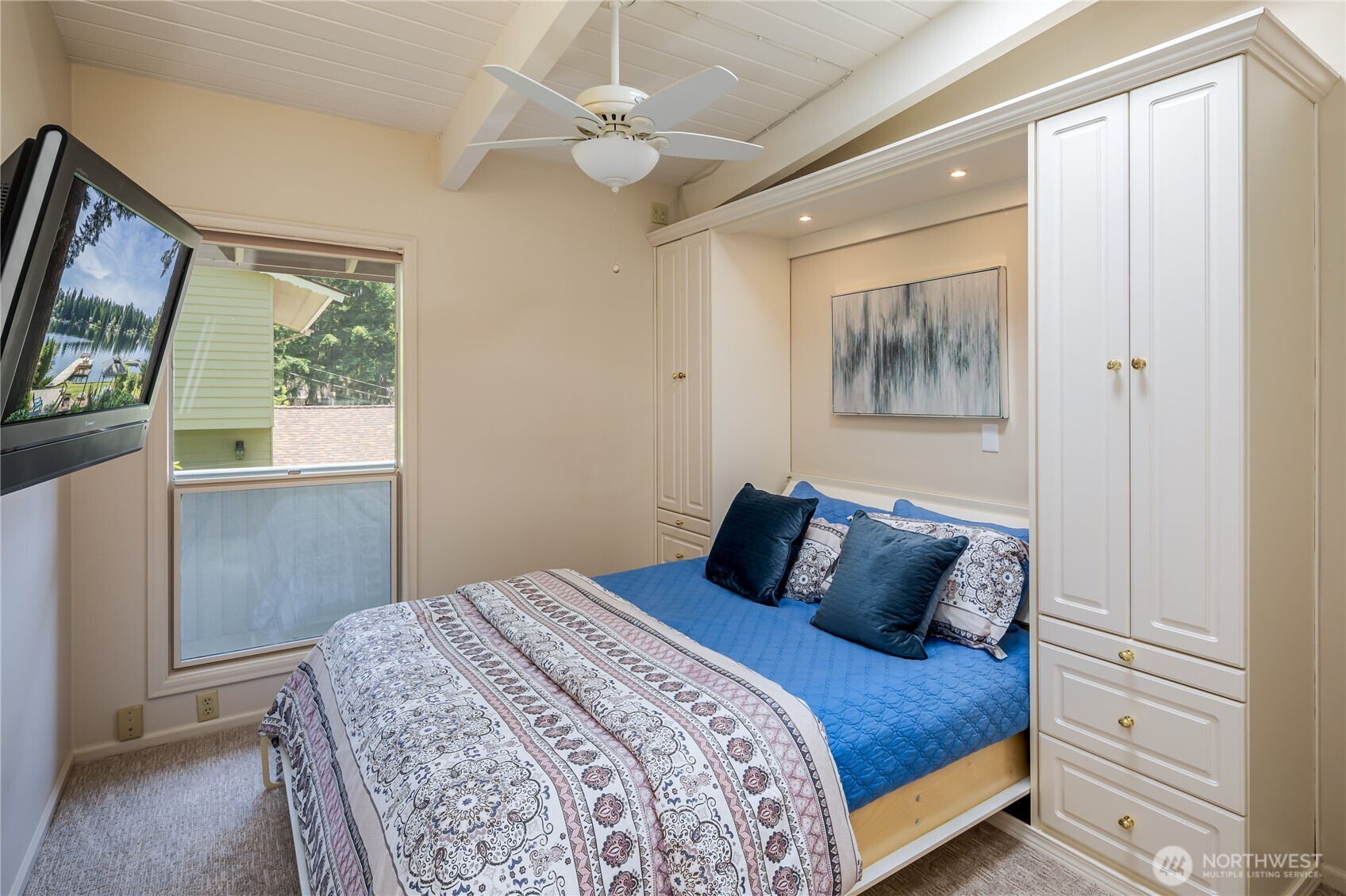 Upstairs guest bedroom. That Murphy bed folds up and becomes a desk.