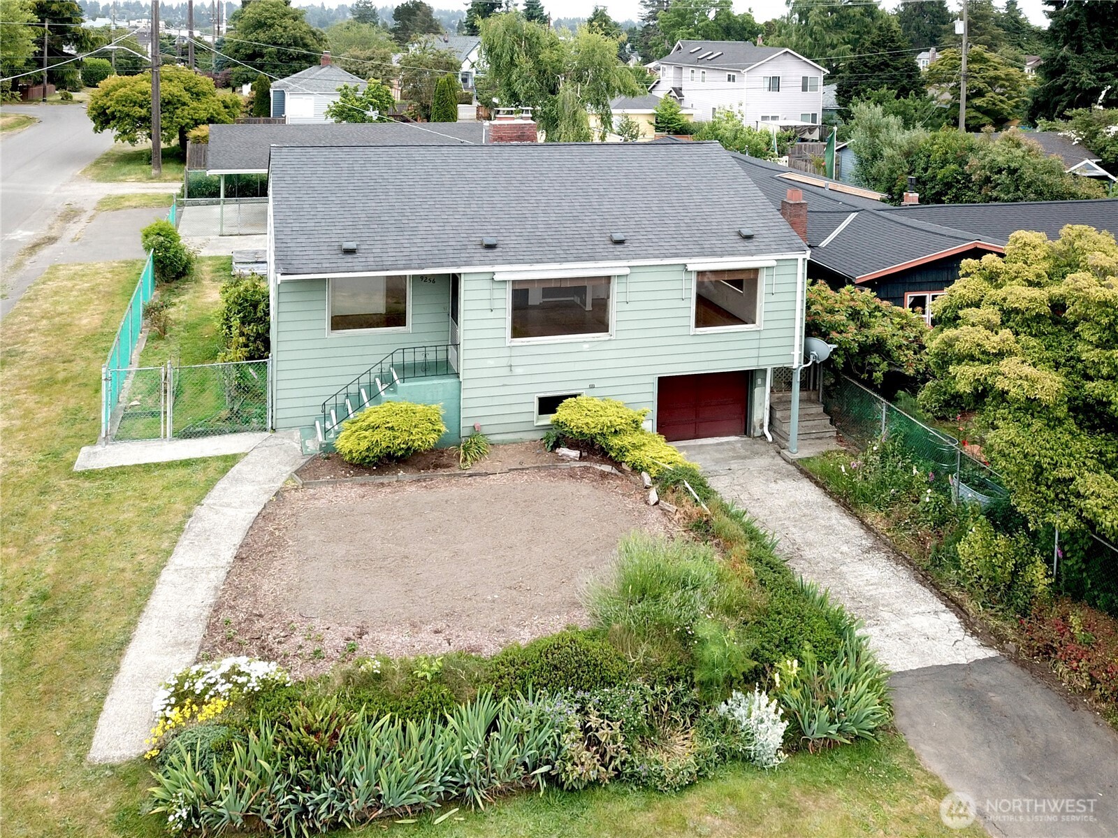 Sweet bungalow on a large corner lot on a friendly walkable Greenwood neighborhood! A great property with enormous investment potential.