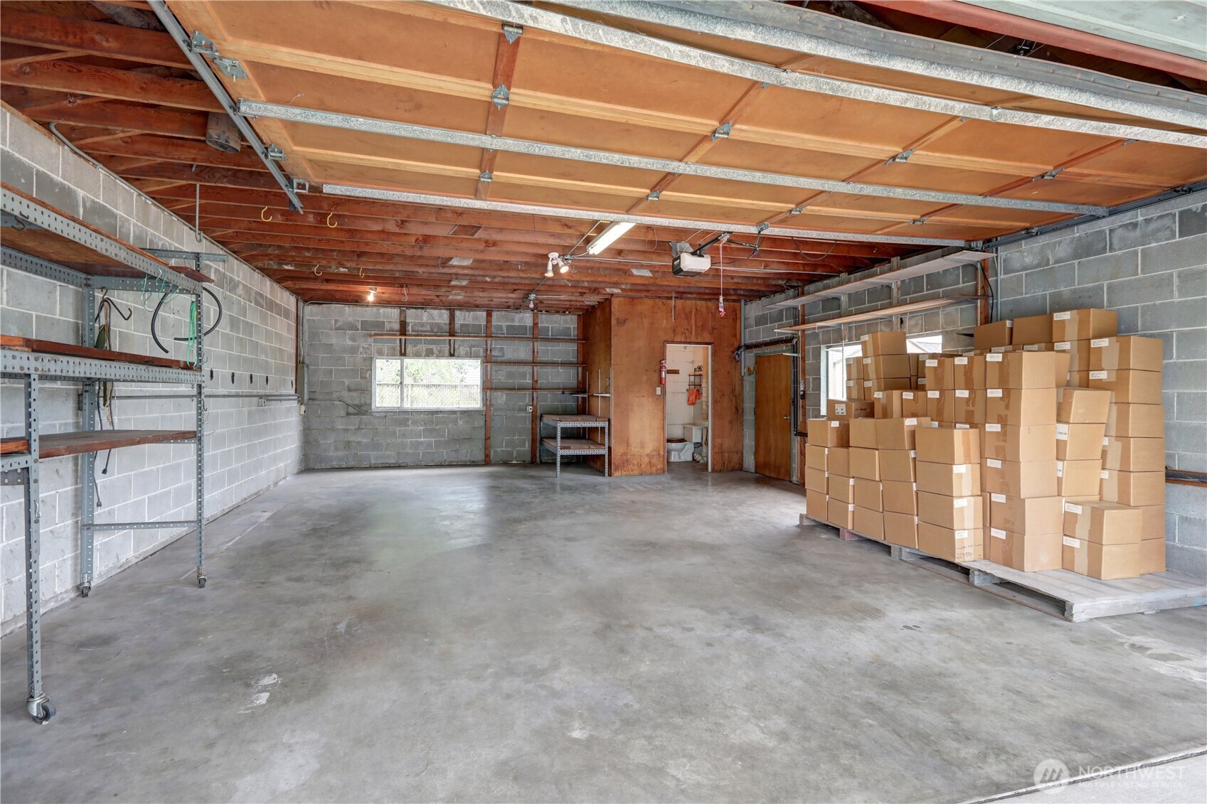 Super clean and dry detached garage ready for your precious toys or your creative ideas.