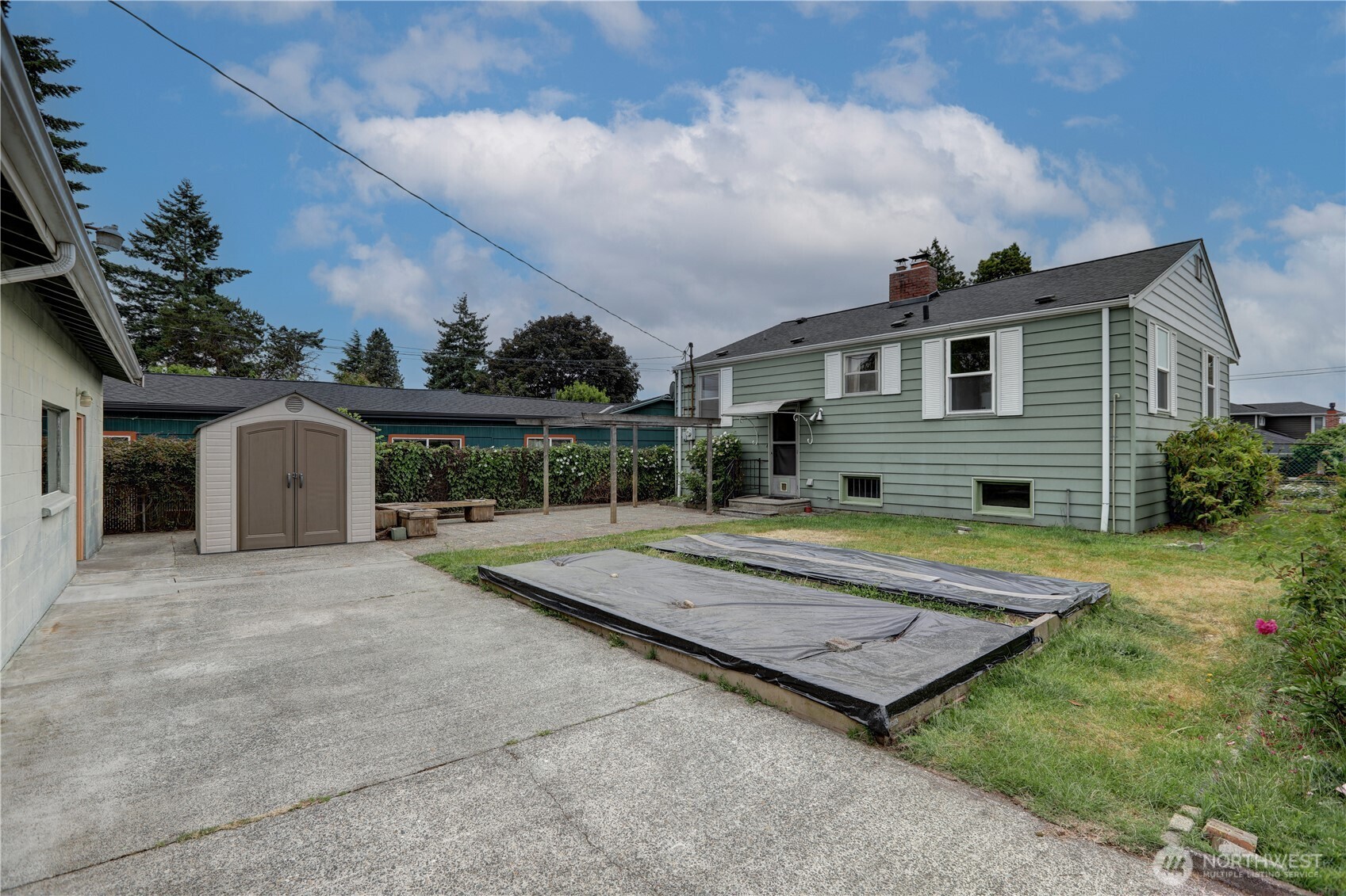 Back yard has shed for your tools, and also and great parking space tor your boat or RV.