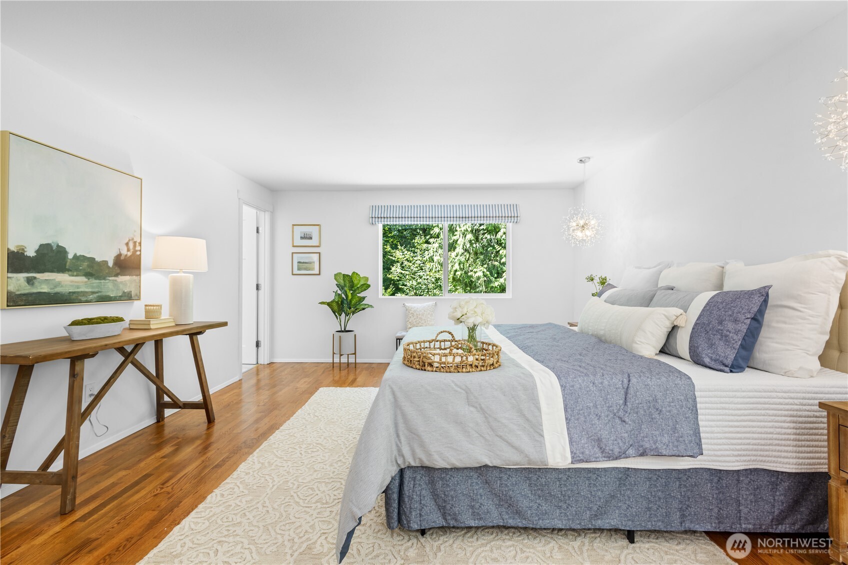 Large ensuite primary with walk-in closet.