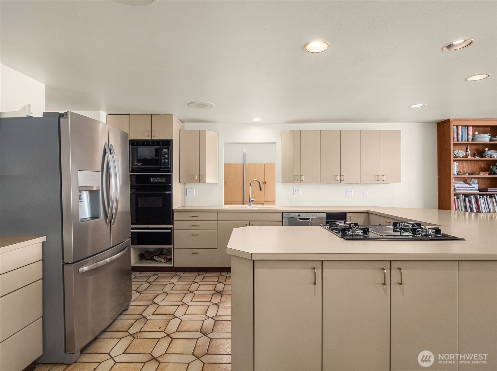 Kitchen is large and offers easy functioning for entertaining.