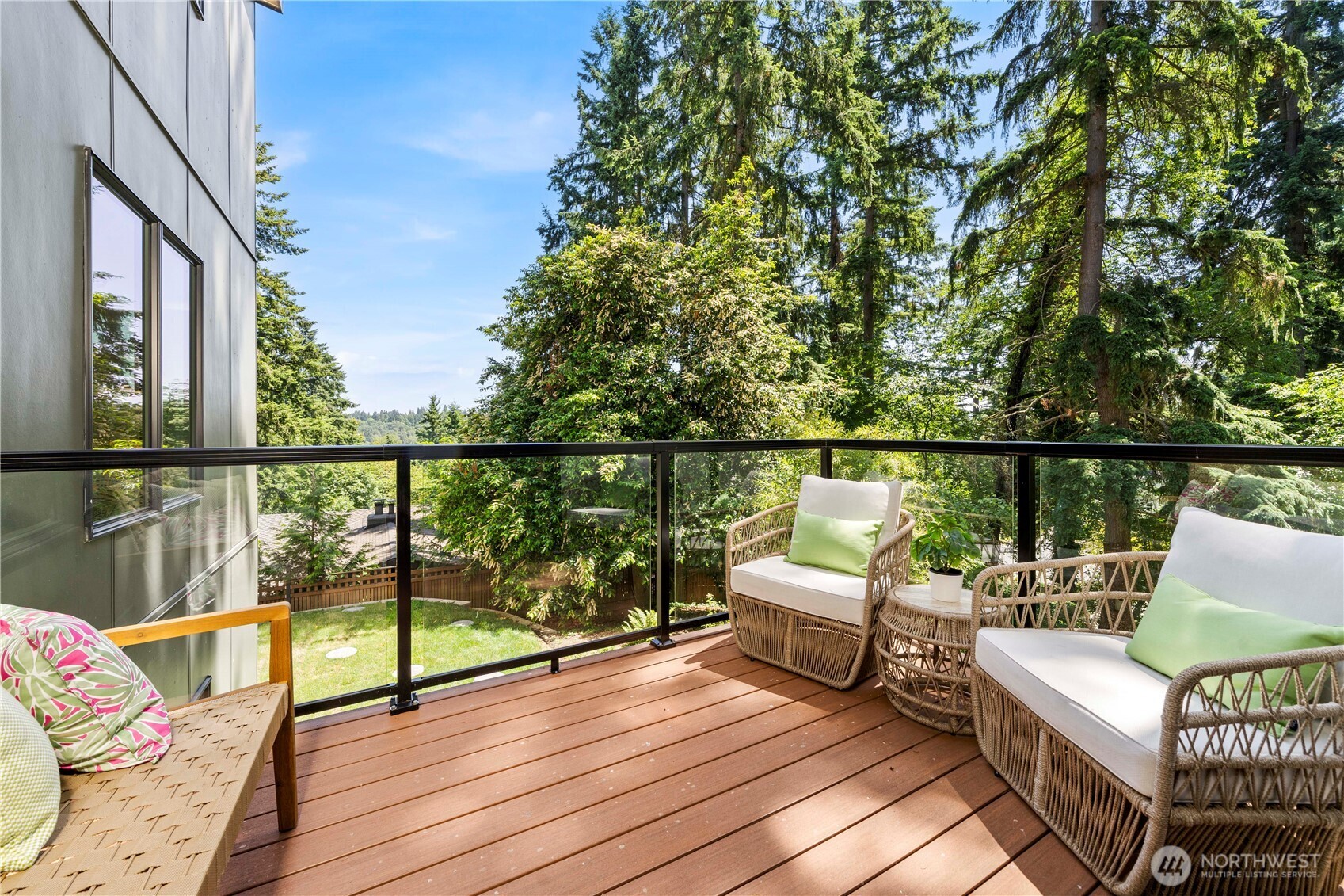 Step out from the sunlit breakfast nook onto a private deck, ideal for enjoying fresh air and peaceful garden views.