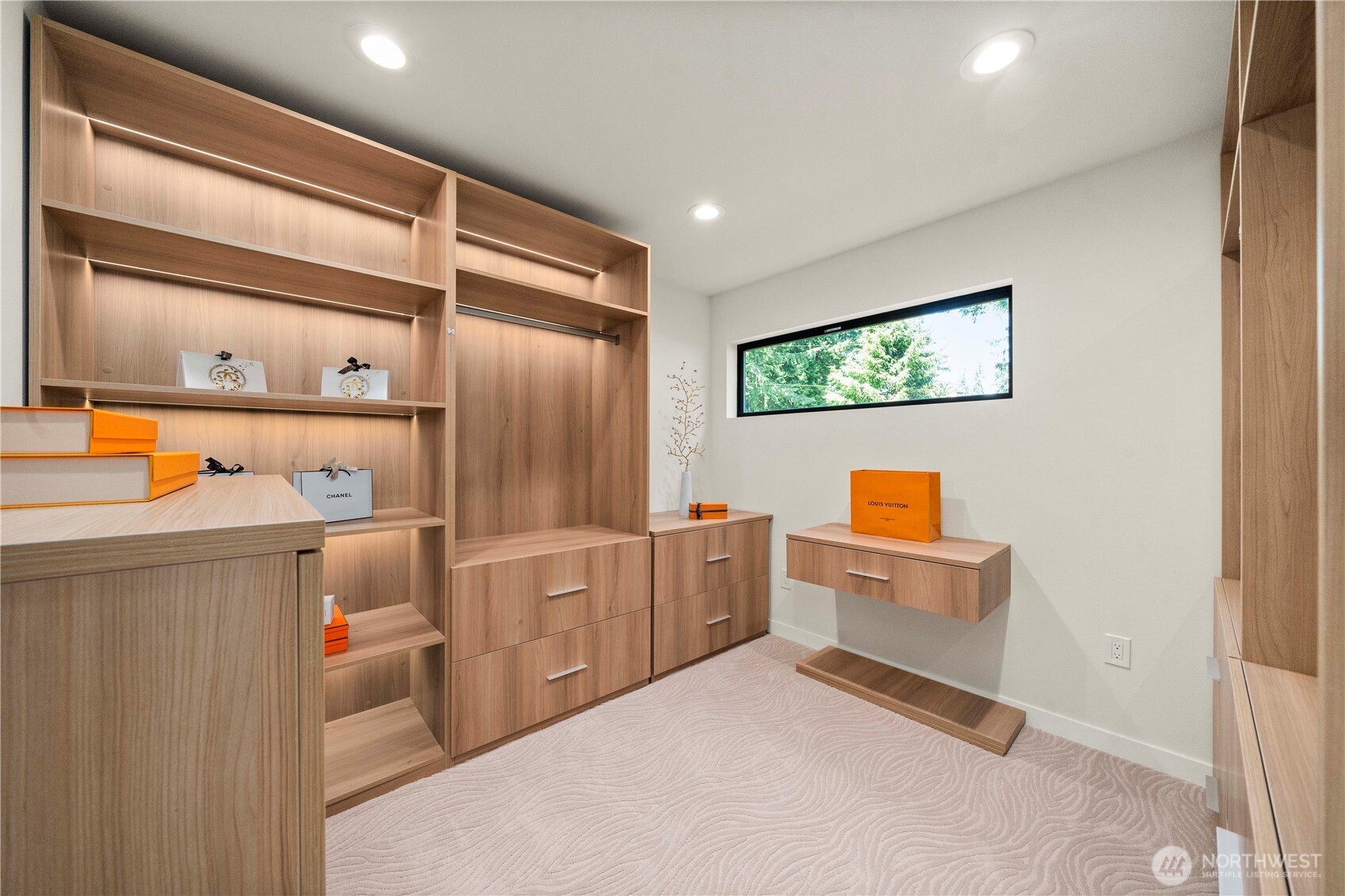 Enjoy a custom-designed closet complete with integrated cabinetry ,shelving and touch on lighting inside the shelves, blending functionality with elegance.