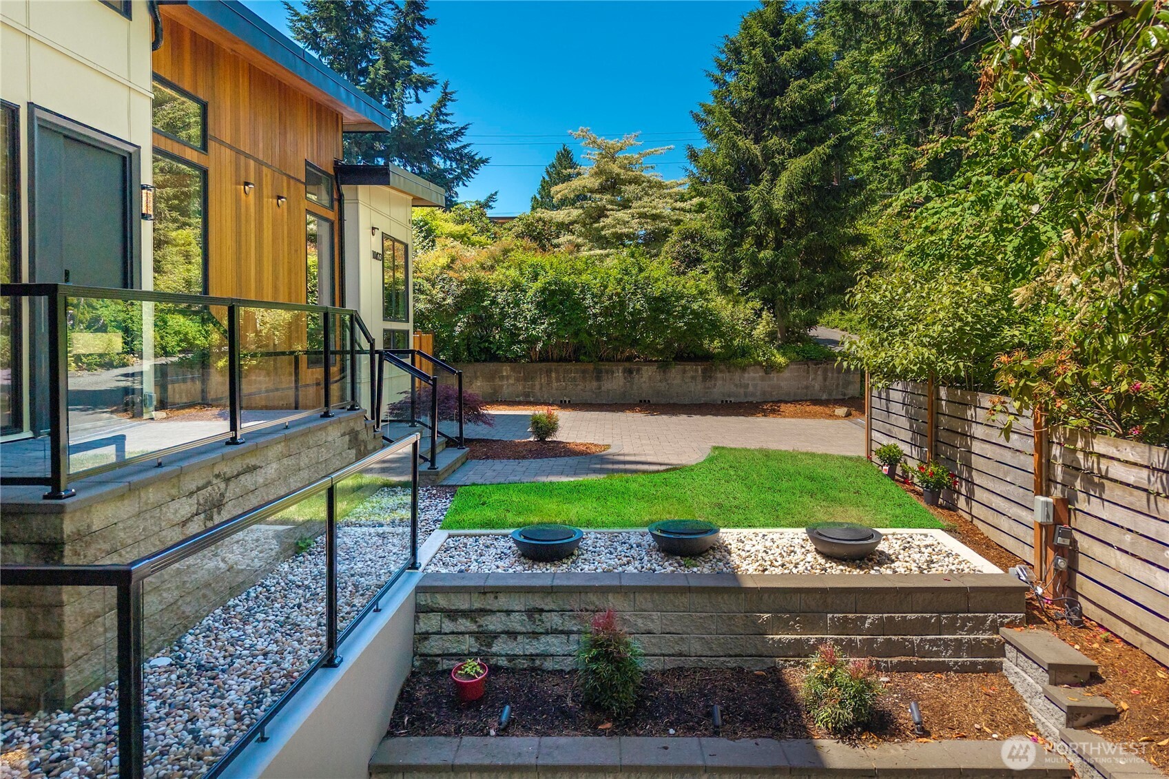 A beautifully designed water feature at the front entry adds a touch of serenity and sophistication, creating a striking first impression.