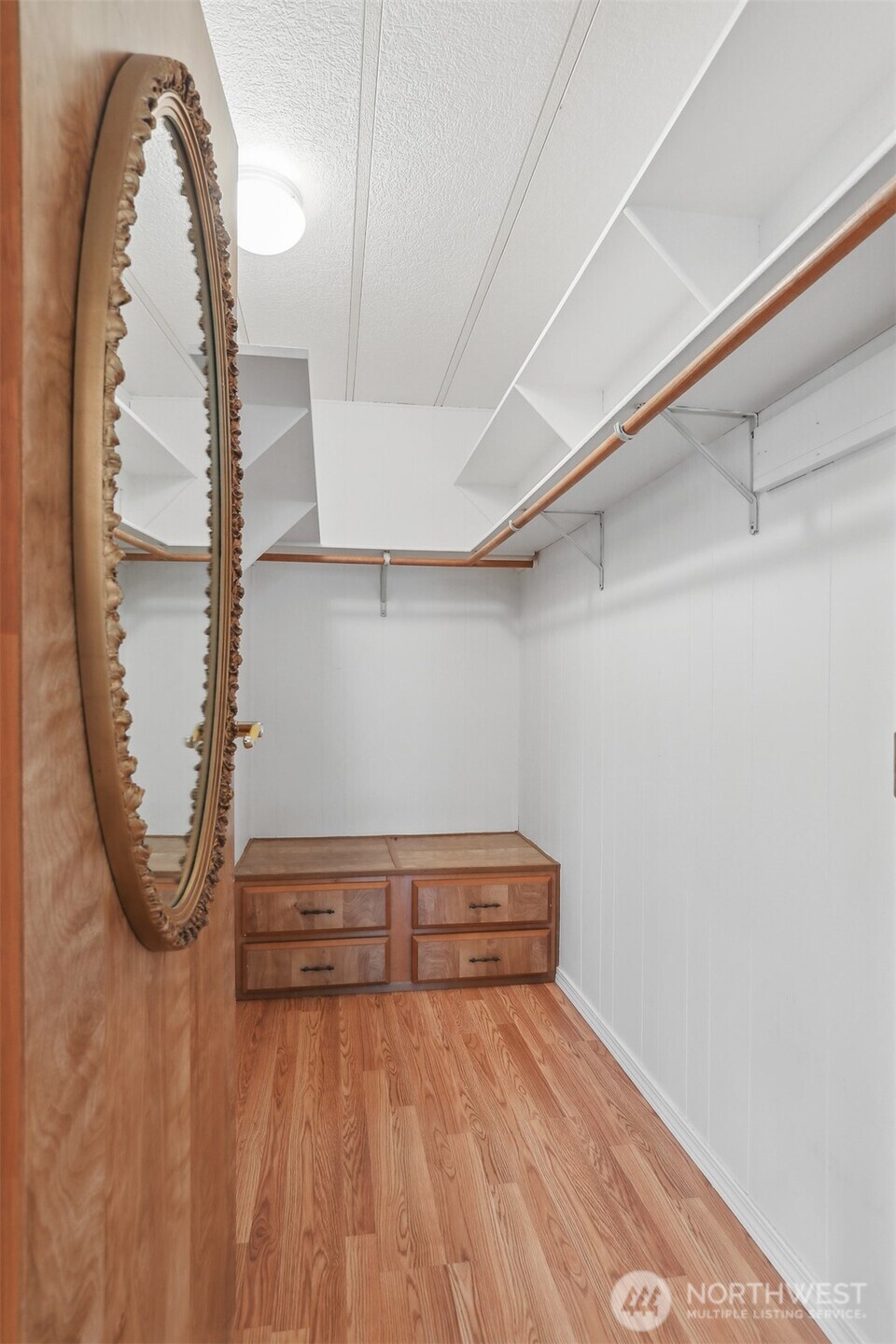 Primary bedroom suite with vaulted ceilings, walk in closet and a fully remodeled tiled 5 piece bathroom.