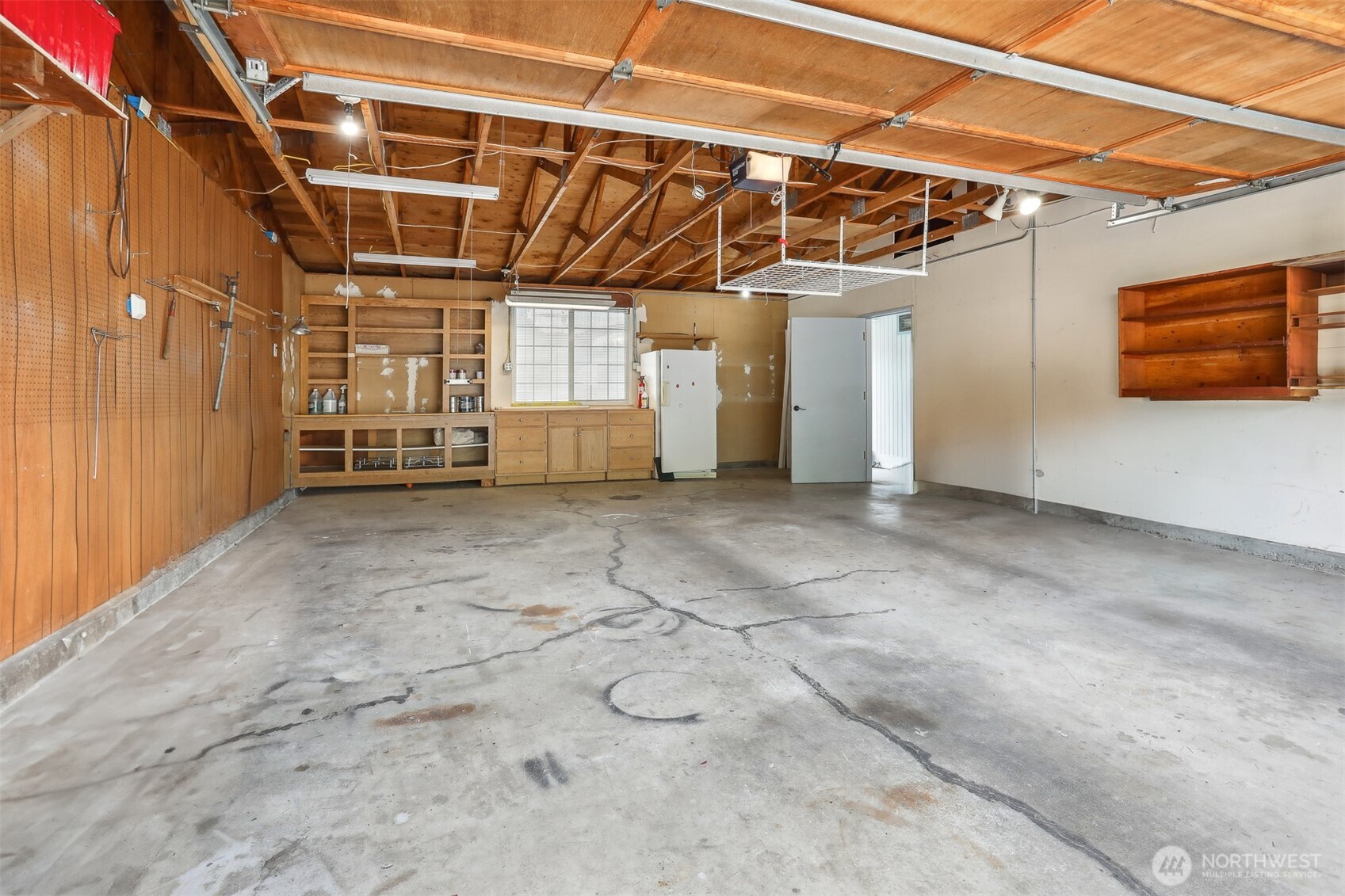 Detached oversized 2 car garage with workshop space and stand up freezer included. 616 sq ft per SCR.