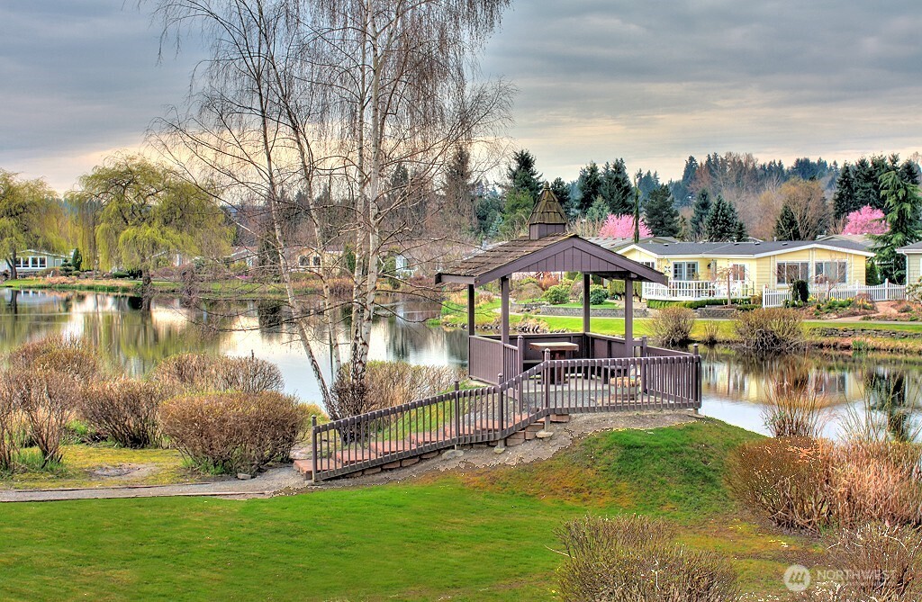Wandering Creek HOA Common Area: Reflection Lake with a paved trail around the perimeter and a gazebo.