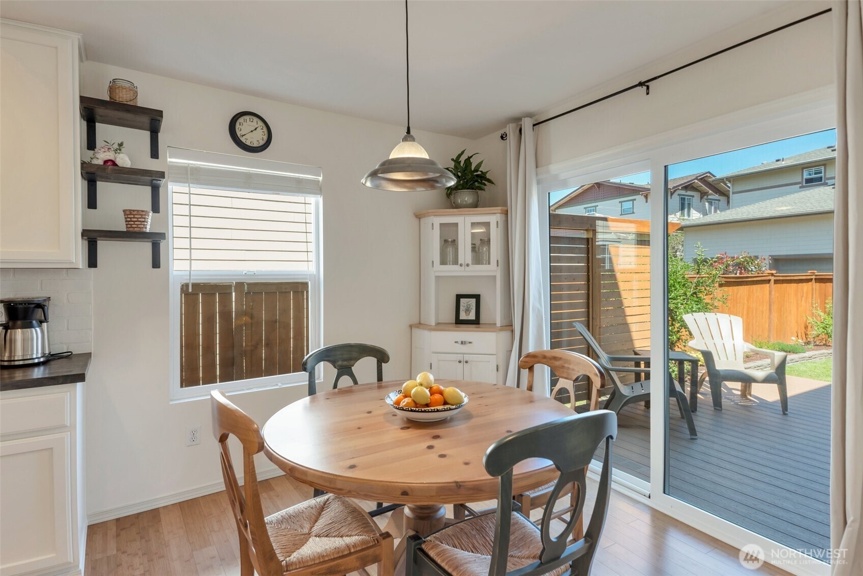 Breakfast nook and slider to private backyard
