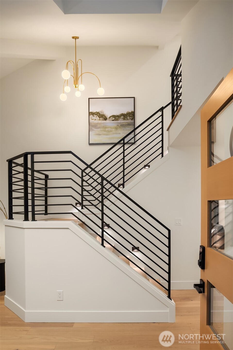 Custom iron railing is showstopping centerpiece.