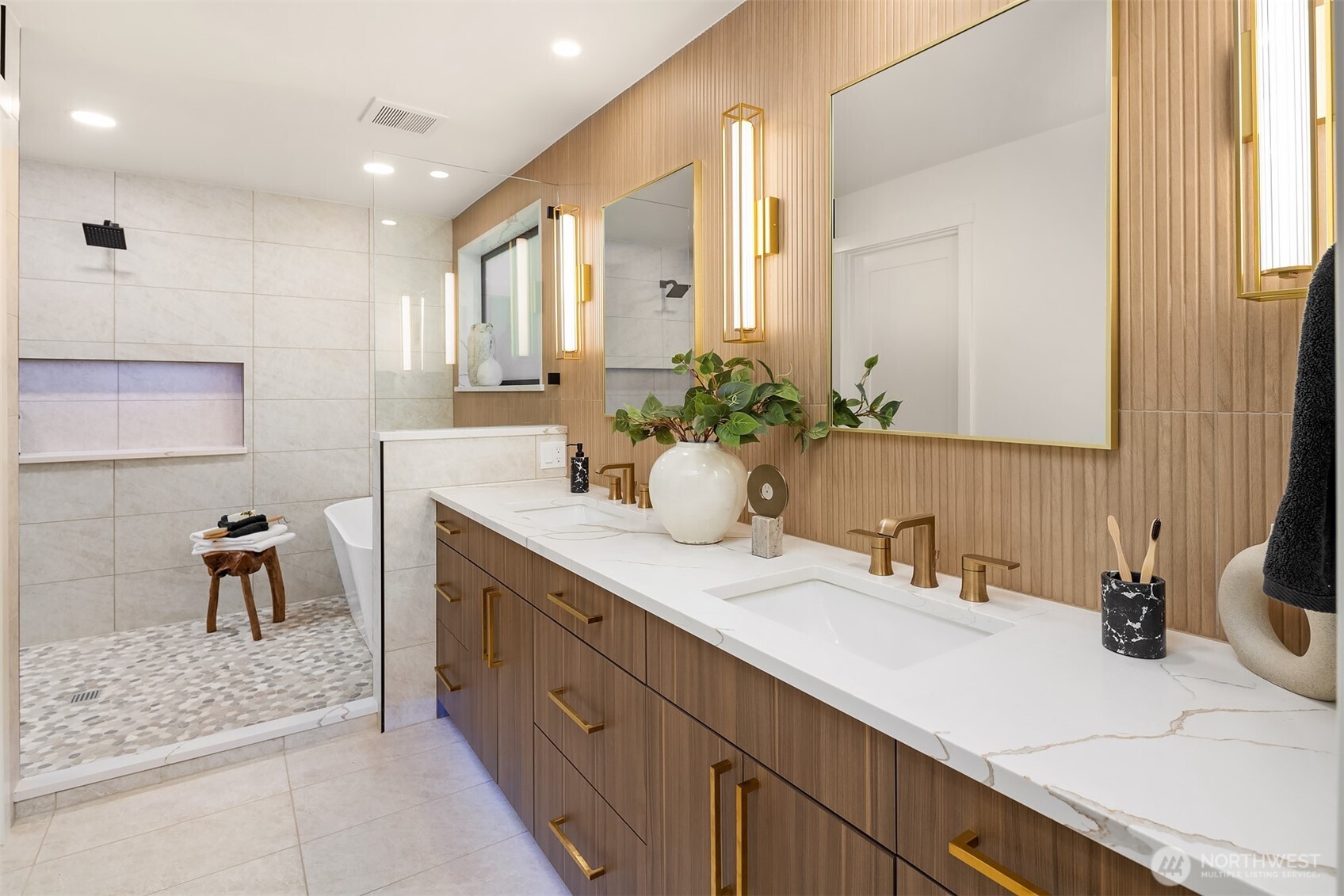 Primary en-suite rivals a spa with custom tile, water room, ADDITIONAL closet, and dual vanity.