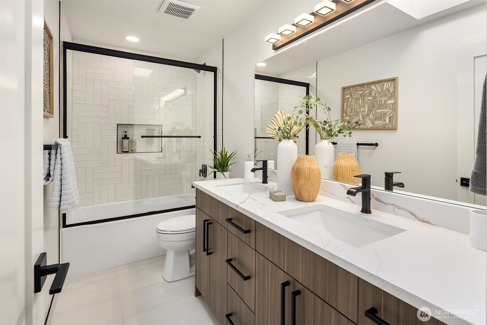 Second full bath serves two additional bedrooms on upper.