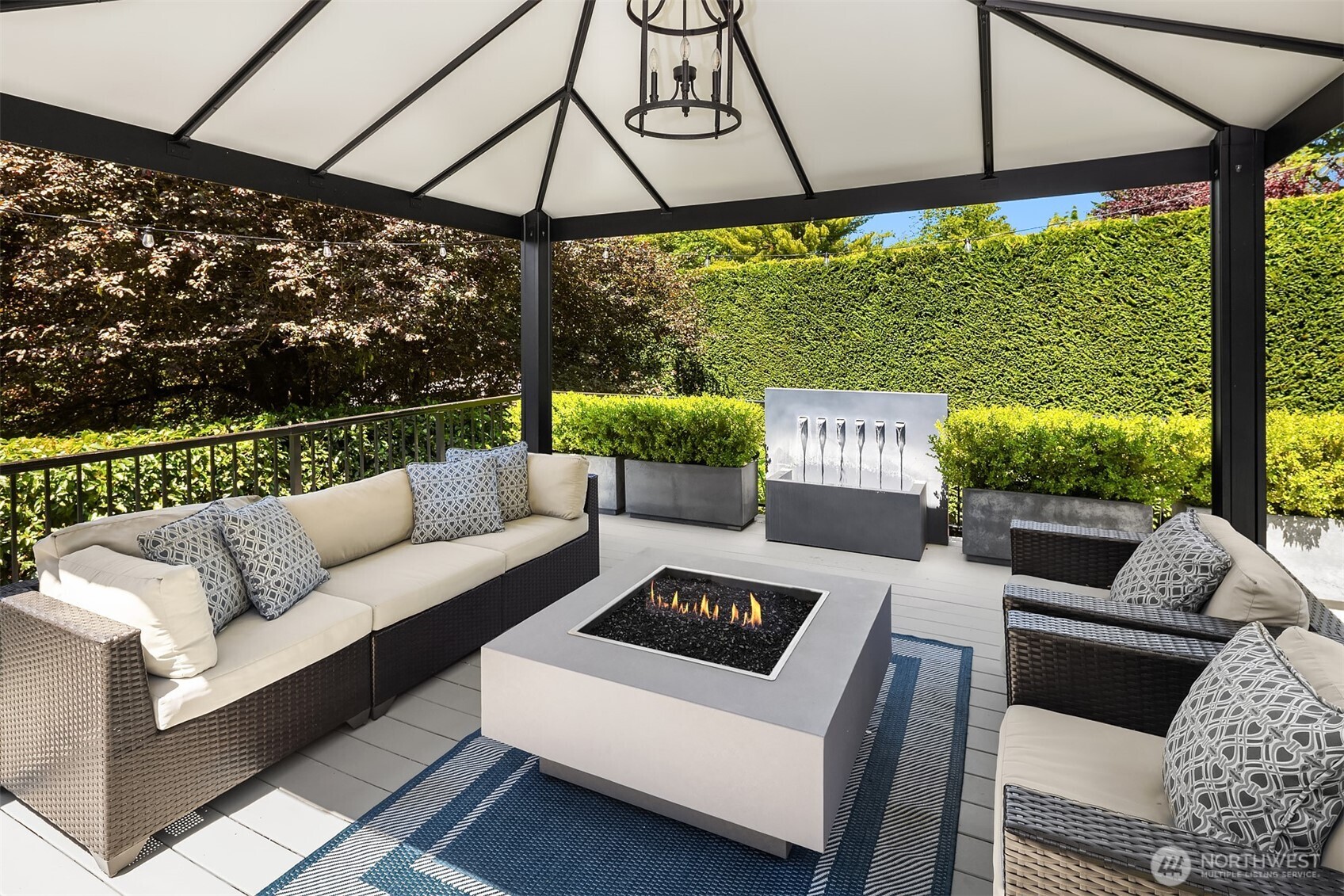 Covered Deck Space with Fireplace and Fountain