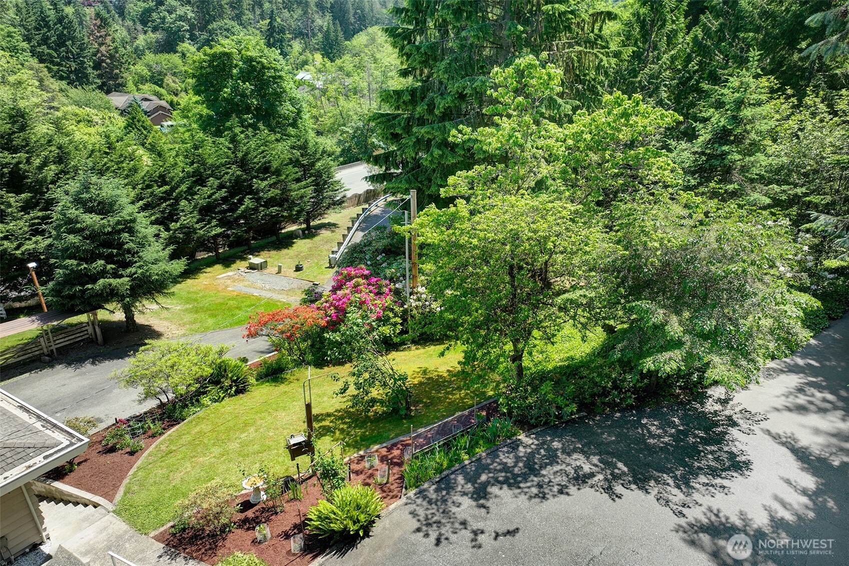 This lovingly maintained property offers dozens of varieties of trees and plants to enjoy year around.