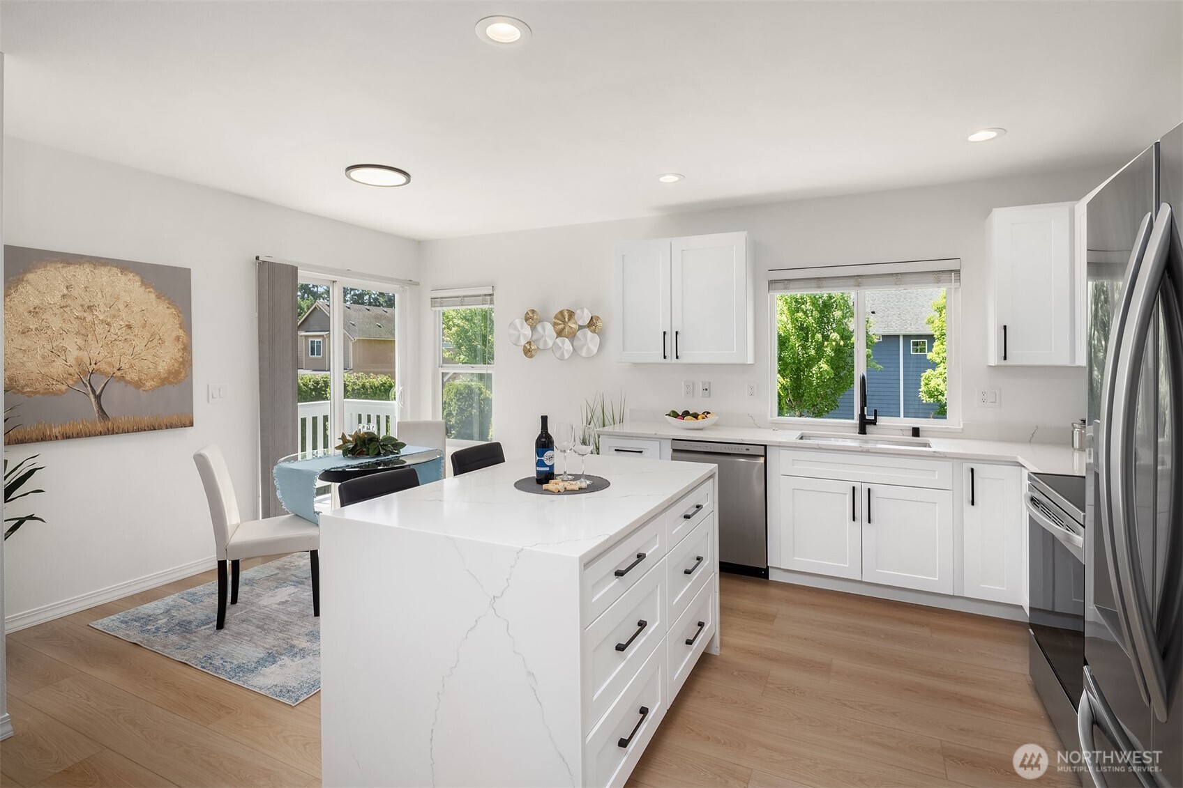Quartz Dual Waterfall Island w/Bar Seating and Soft Close Drawers Throughout Kitchen, Eating Space & Slider to Deck