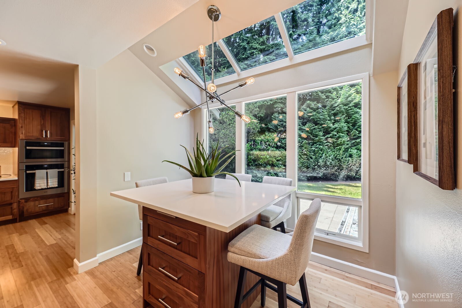 Breakfast nook with a skywall window to enjoy the lush view.