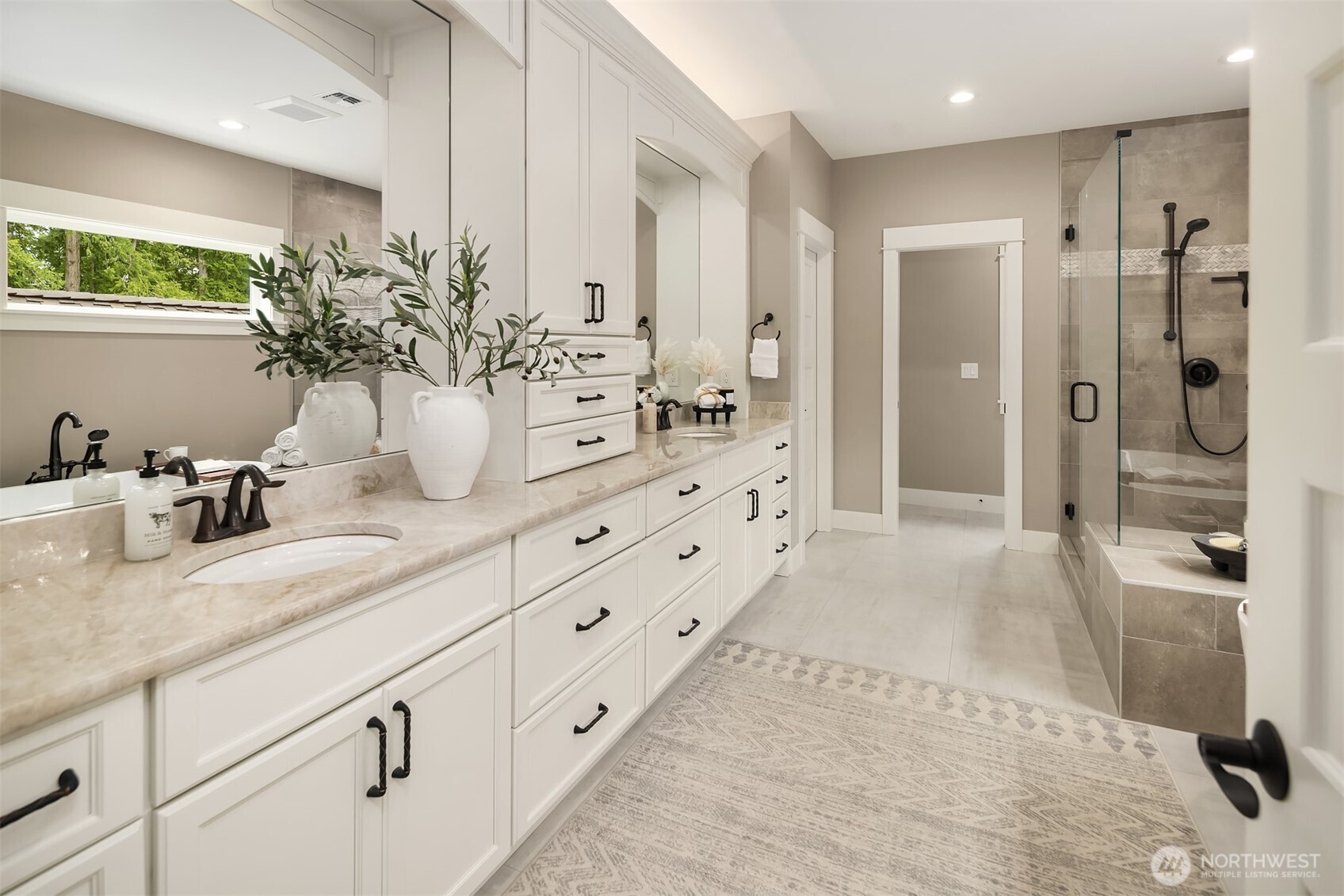 Spa inspired luxury bath with soaking tub, large shower, gas fireplace, and huge walk in closet.