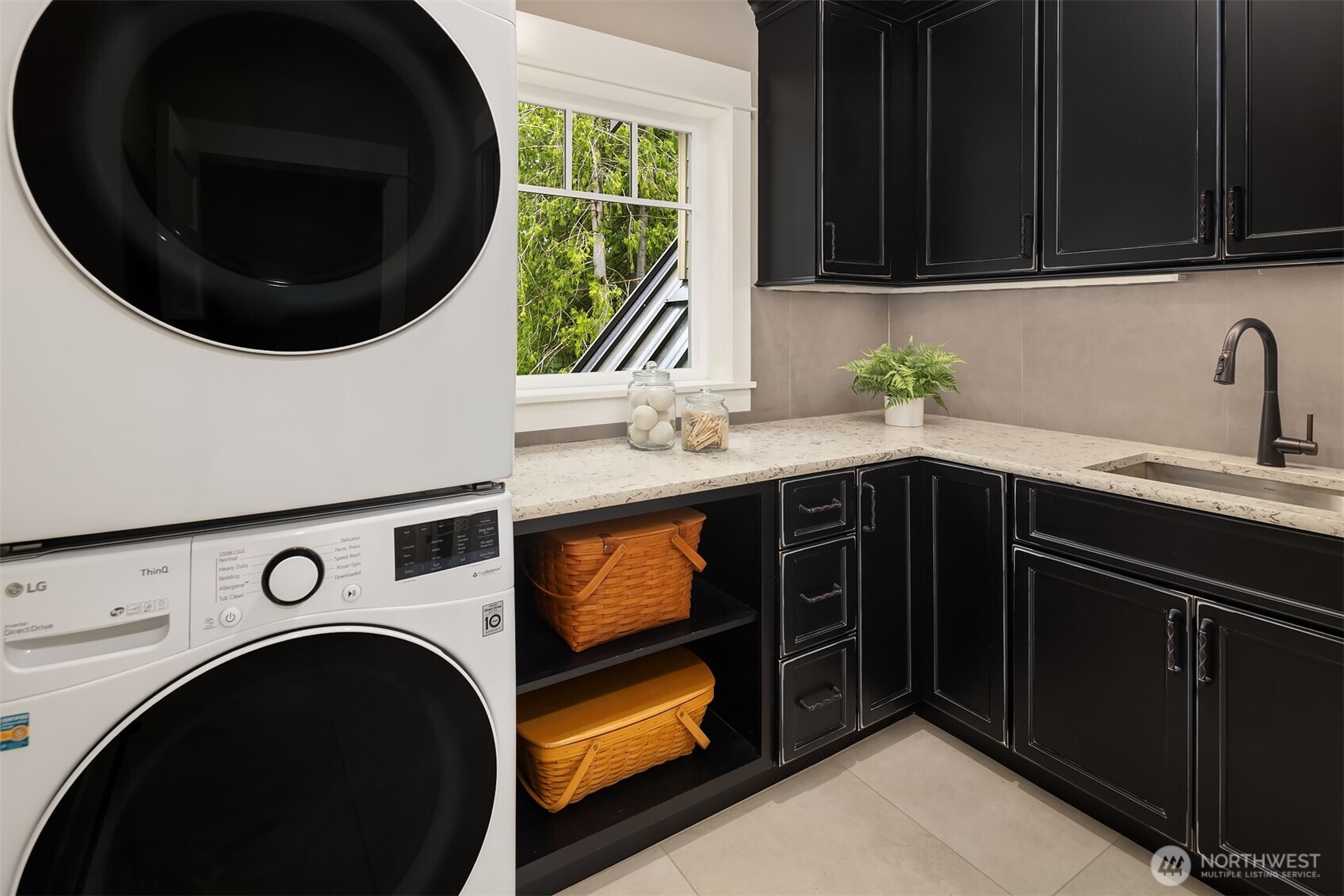 Upper level laundry with large walk in closet. This is one of 2 laundry rooms.