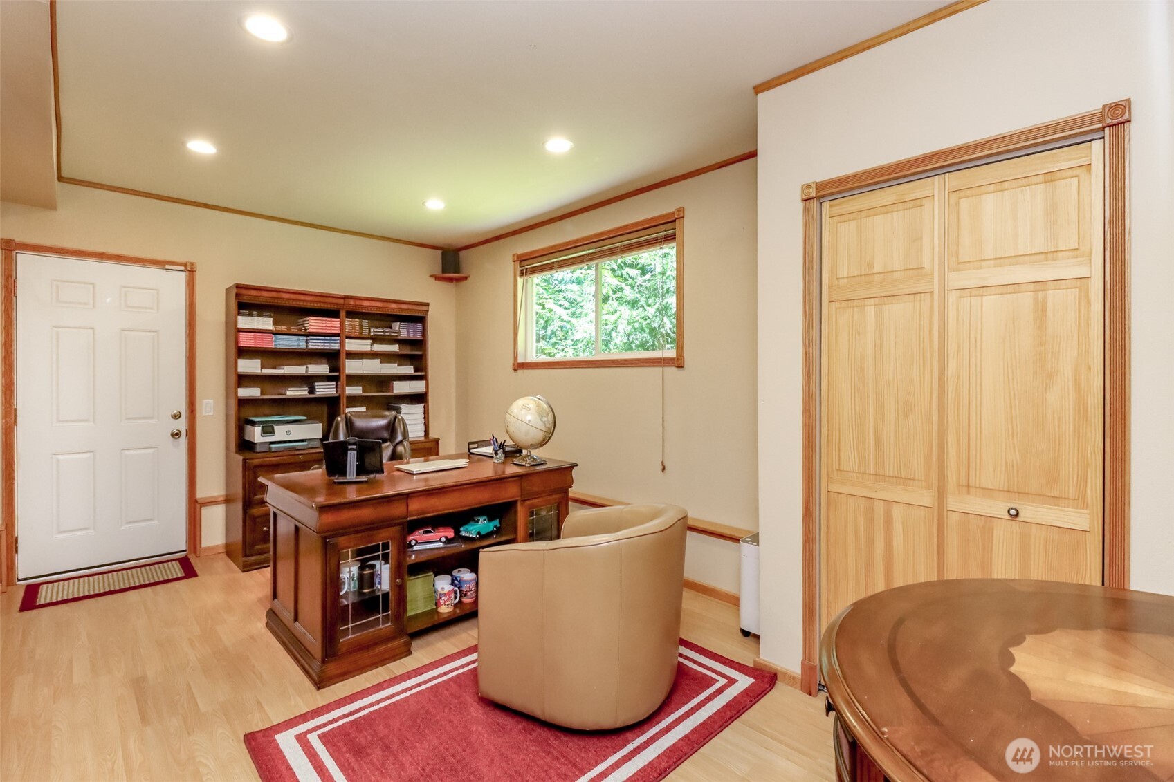 Large office with a door to the exterior (great for running a business from home, or potential for a separate living space)