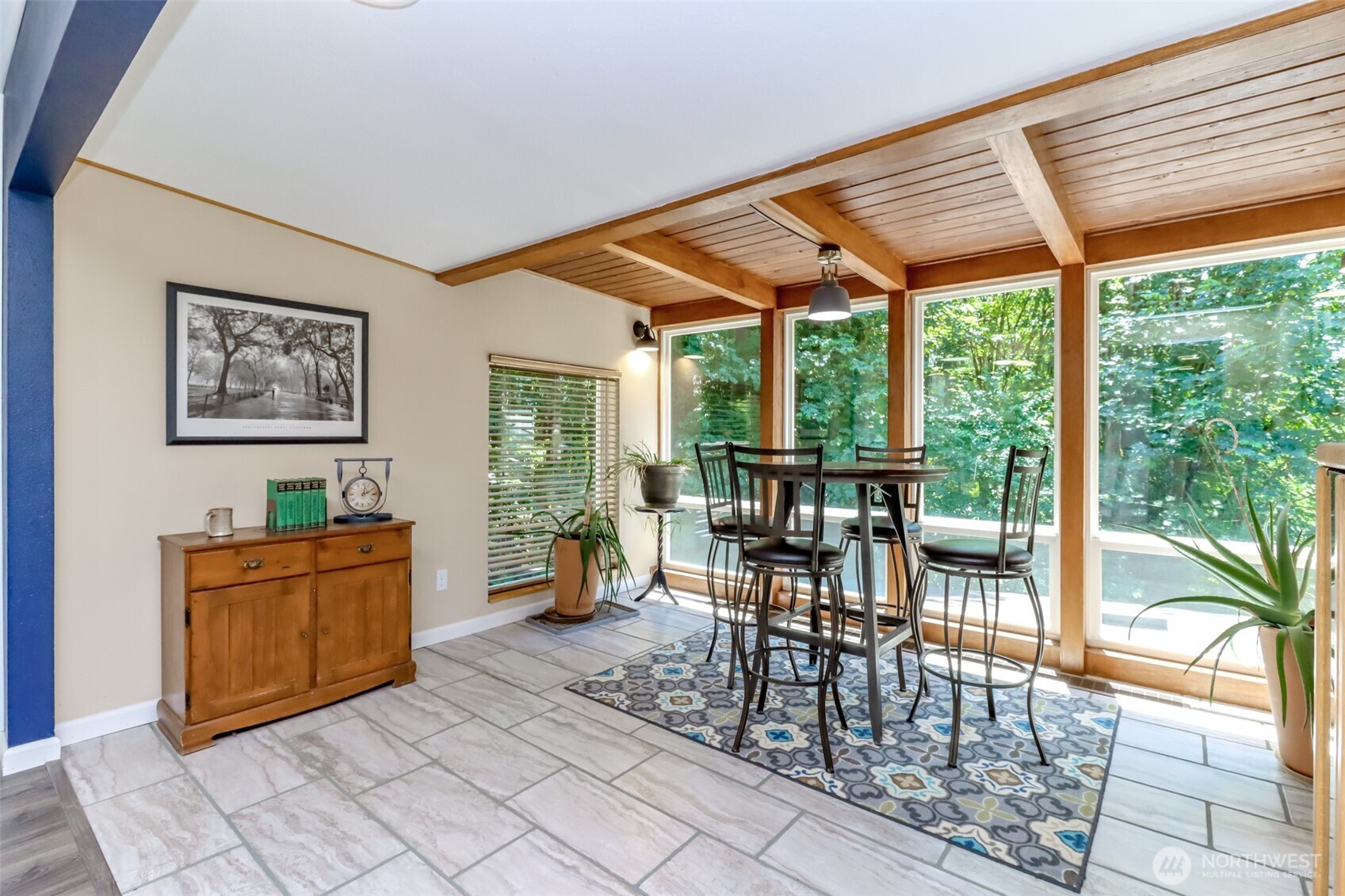 Enjoy eating in the solarium overlooking your backyard and the trees beyond.