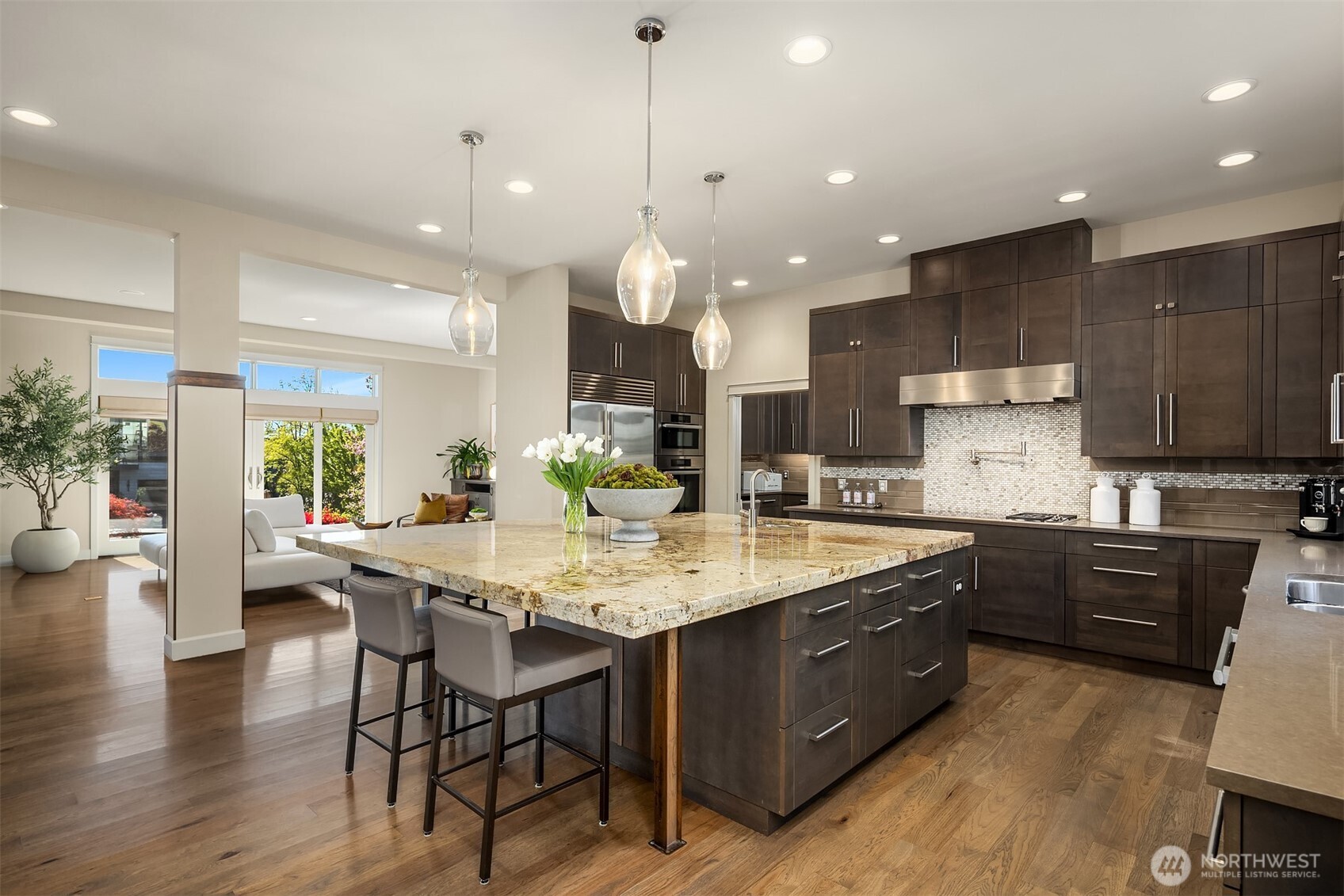 Everyone's gathering around the island and you can see why! Great amenities like the catering kitchen and pantry make entertaining feel fun. Such a great floor plan you have to come see!