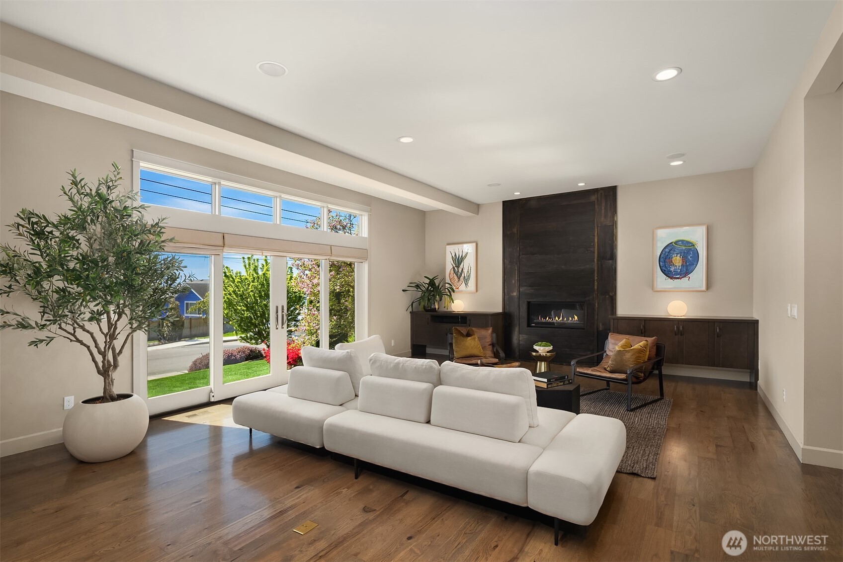 We love this custom metal fireplace. It is a beautiful artisan statement. Wonderful french doors let you enjoy Kirkland's mosst beloved and friendly street.