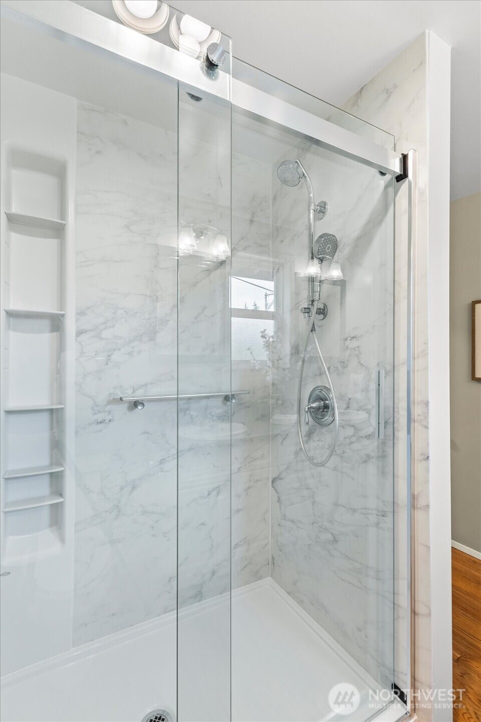 Kohler seamless shower and product shelving; handheld shower head