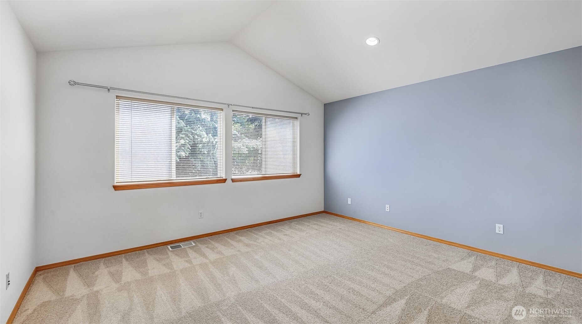Primary bedroom vaulted ceilings.