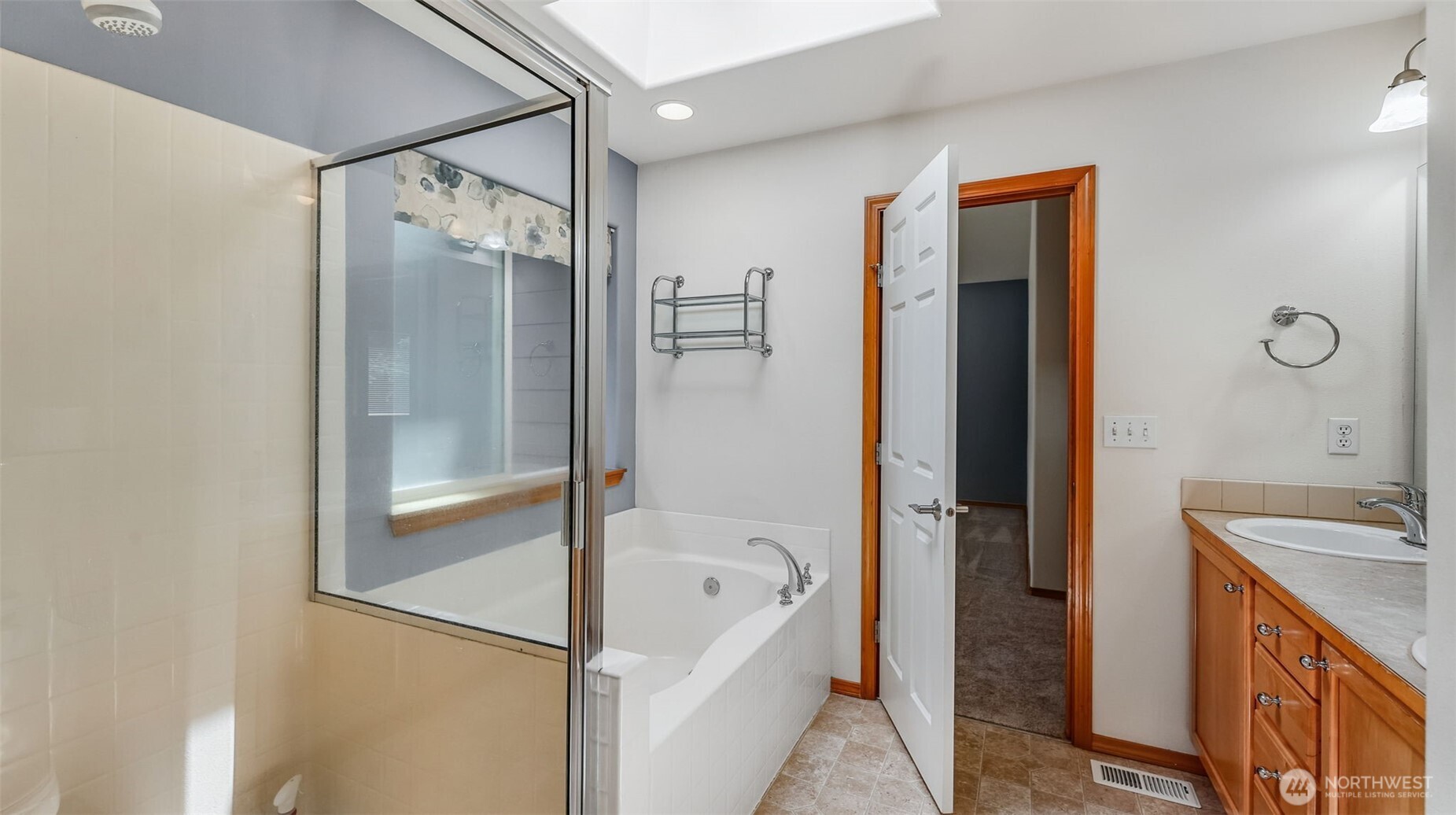 Primary bathroom with shower and soaking tub.