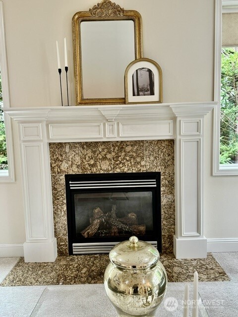 Family room gas fireplace with granite and beautiful mantle