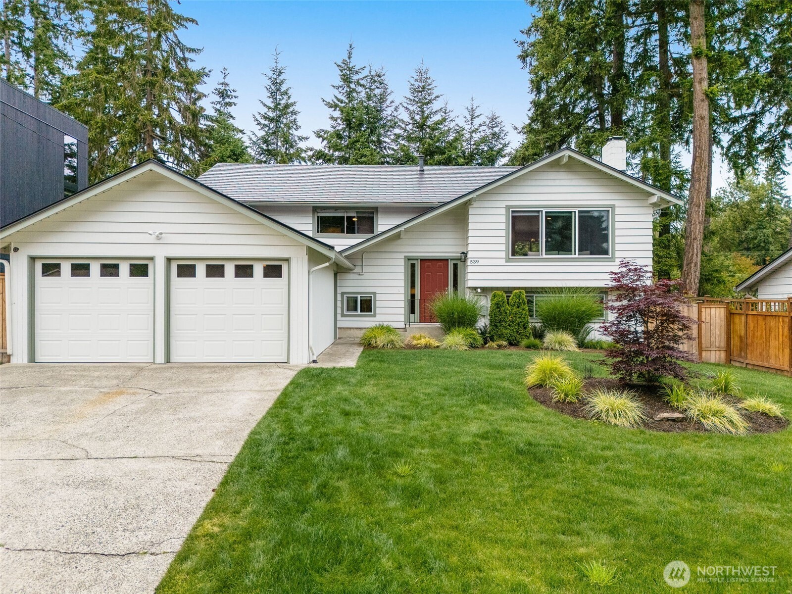 The exterior has been painted and landscaping has been meticulously maintained; carport has been turned into a 2 car garage,