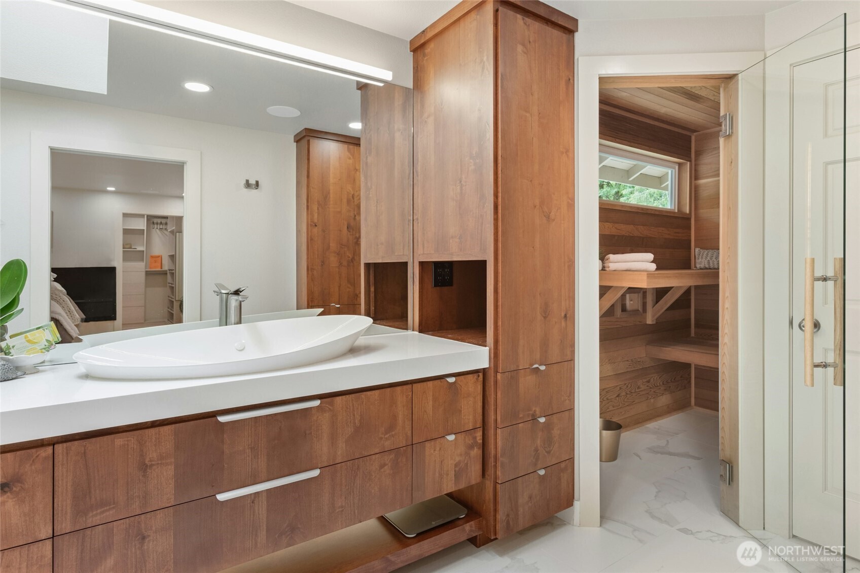 Custom Acorn Cabinetry, heated floors with Porcelanosa tiles. Laundry chute!