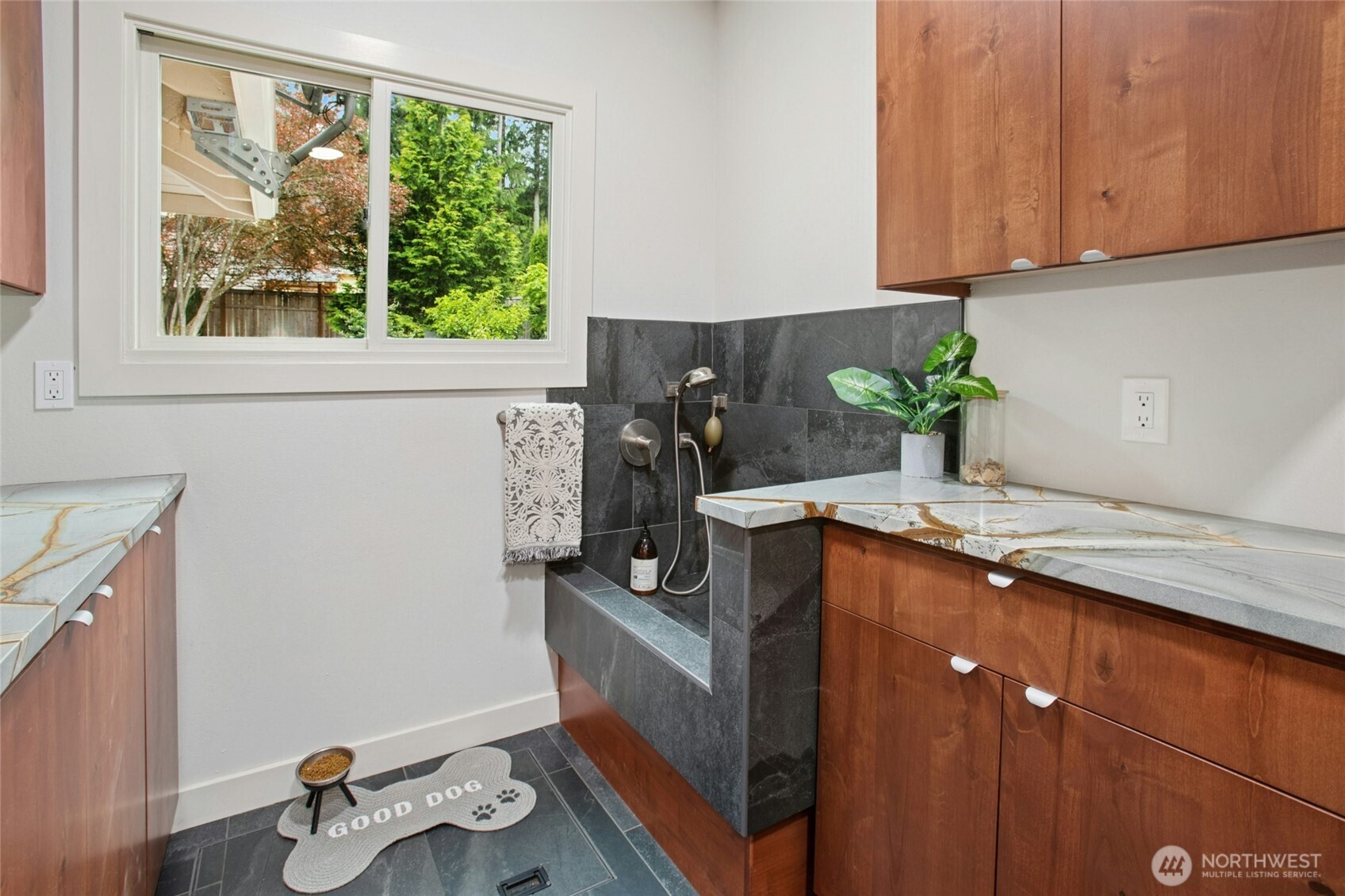 Remodeled with mudroom/doggy bath with Porcelanosa tiles and Brazilian blue granite countertop.
