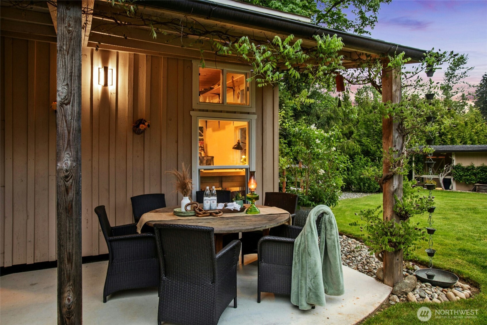 Terrasse has a mature wisteria and is protected with space for eating or doing projects outdoors.