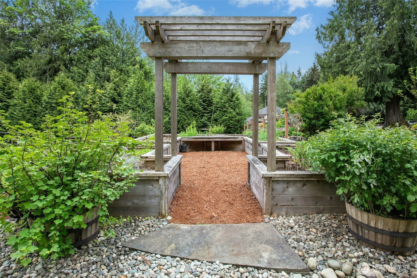 Cedar boxes (no chemicals) and organic veggies and fruits garden (soil is organic, fertilizer has only been organic and vegetables/ fruits too - no chemicals, no pesticides) and has a watering system. • Apple tree is a mature organic espalier with 6 different types of apples (> 8 yrs old tree) • Pear tree is a mature organic espalier with 6 different types of apples (> 8 yrs old )